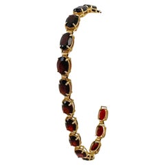 Bracciale tennis in oro giallo 14k con granato rosso taglio ovale da 8,7 g, 7,25".