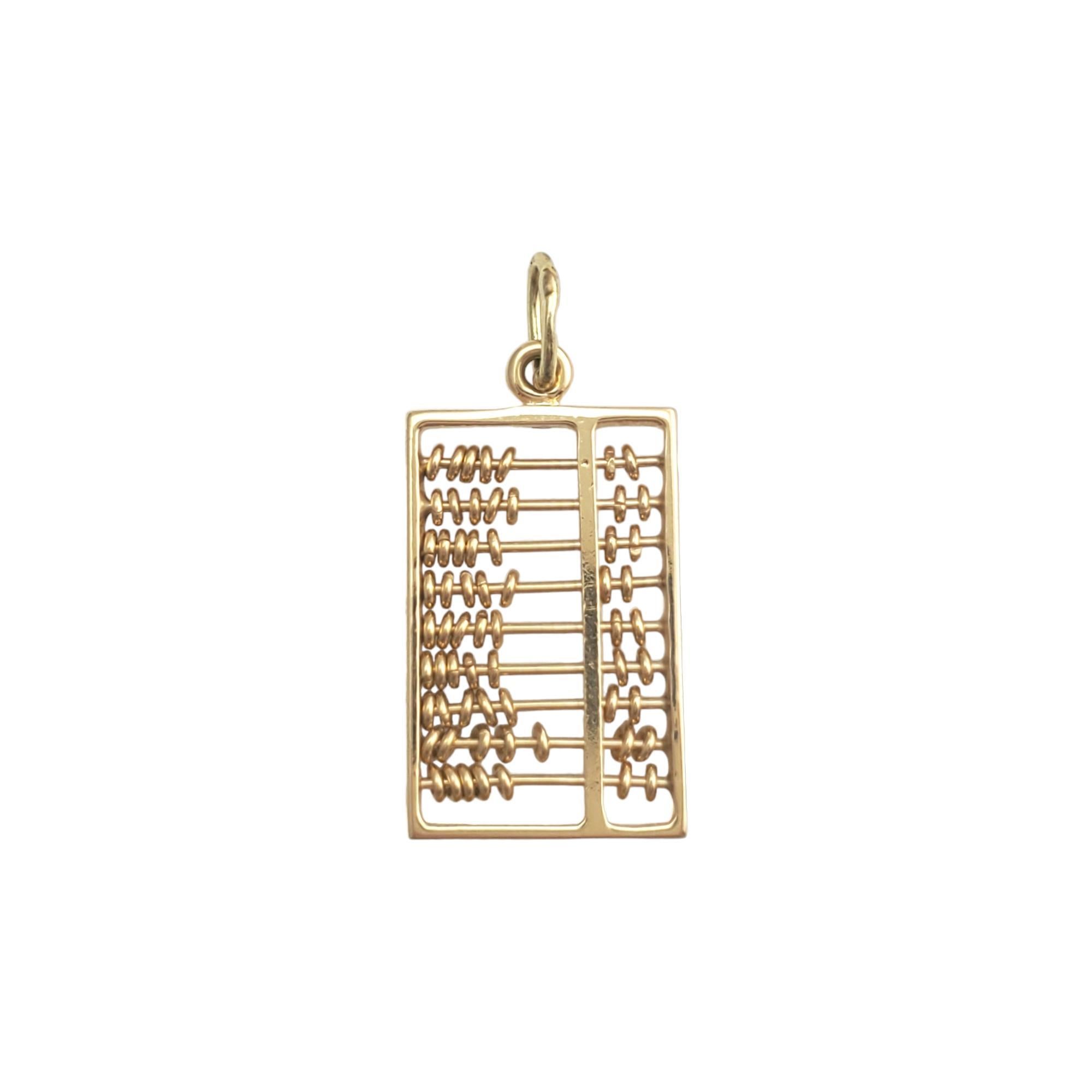 Vintage 14K Yellow Gold Abacus Charm with Sliding Beads - 

This simple charm is crafted in meticulously detailed 14K yellow gold. 
 
Size: 22.21mm X 2.18 mm

Weight: 1.4 dwt. / 2.3 gr.

Marked: 14K C

Very good condition, professionally