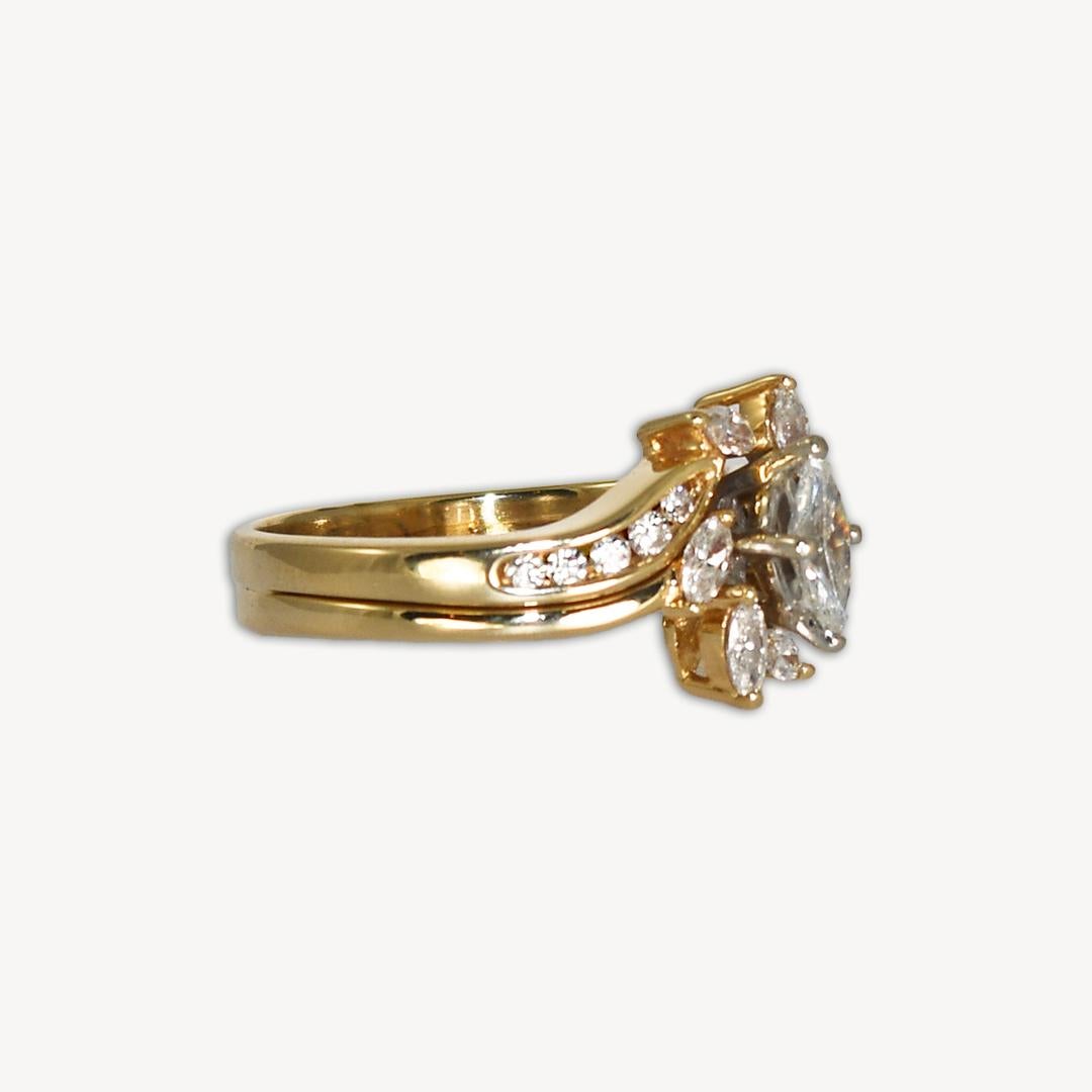 Marquise diamond ring in 14k yellow gold.
Marked 14k and weighs 4.6 grams.
The center diamond is marquise shape, .30 carats, H-I color, VS1-VS2 clarity and excellent cut.
There are 10 round brilliant  and 6 small marquise diamonds, on the sides .45