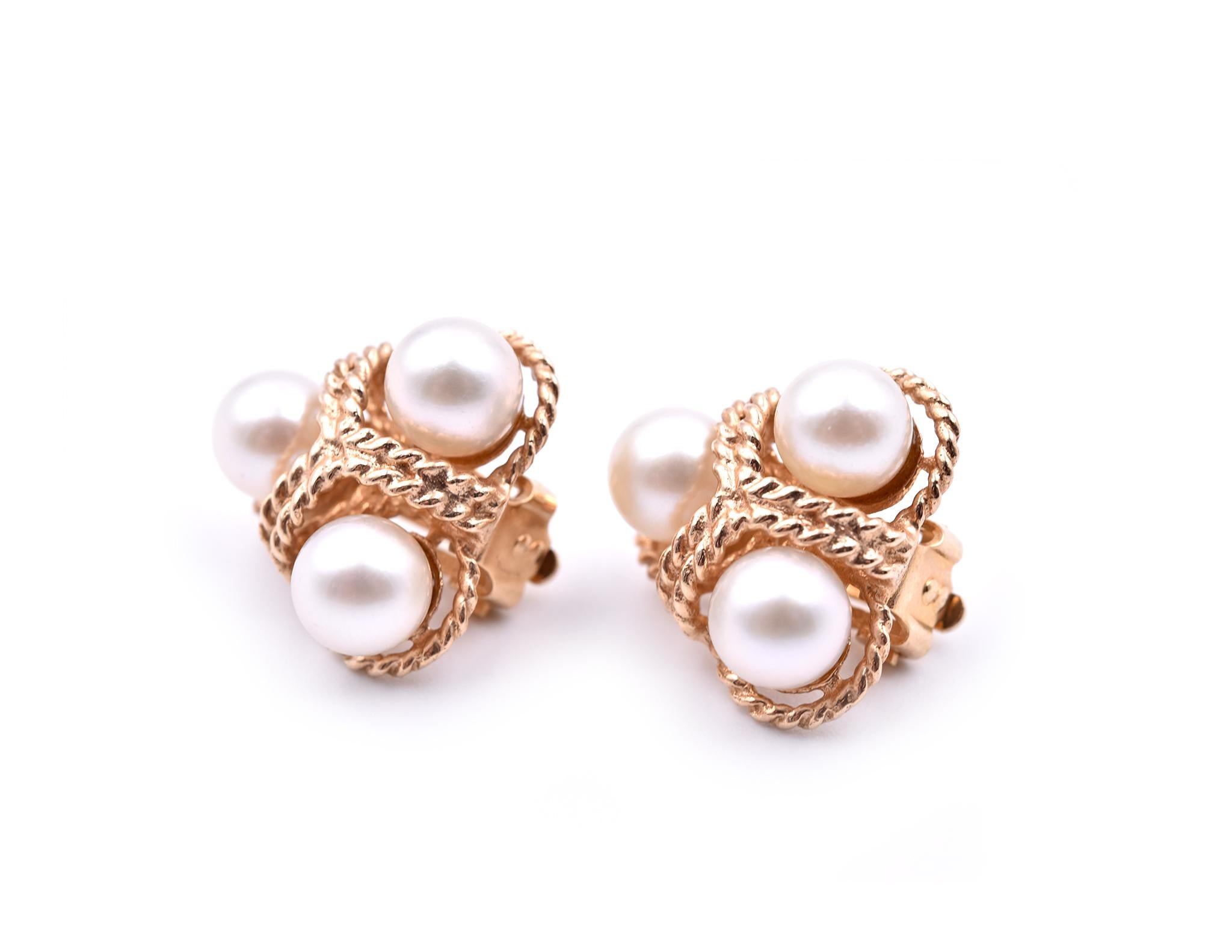 Designer: custom design
Material: 14k yellow gold
Pearls: cultured Akoya pearls
Fastening: clip-on
Dimensions: Earrings measure approximately 15.95mm x 17.15mm
Weight: 7.14 grams	
