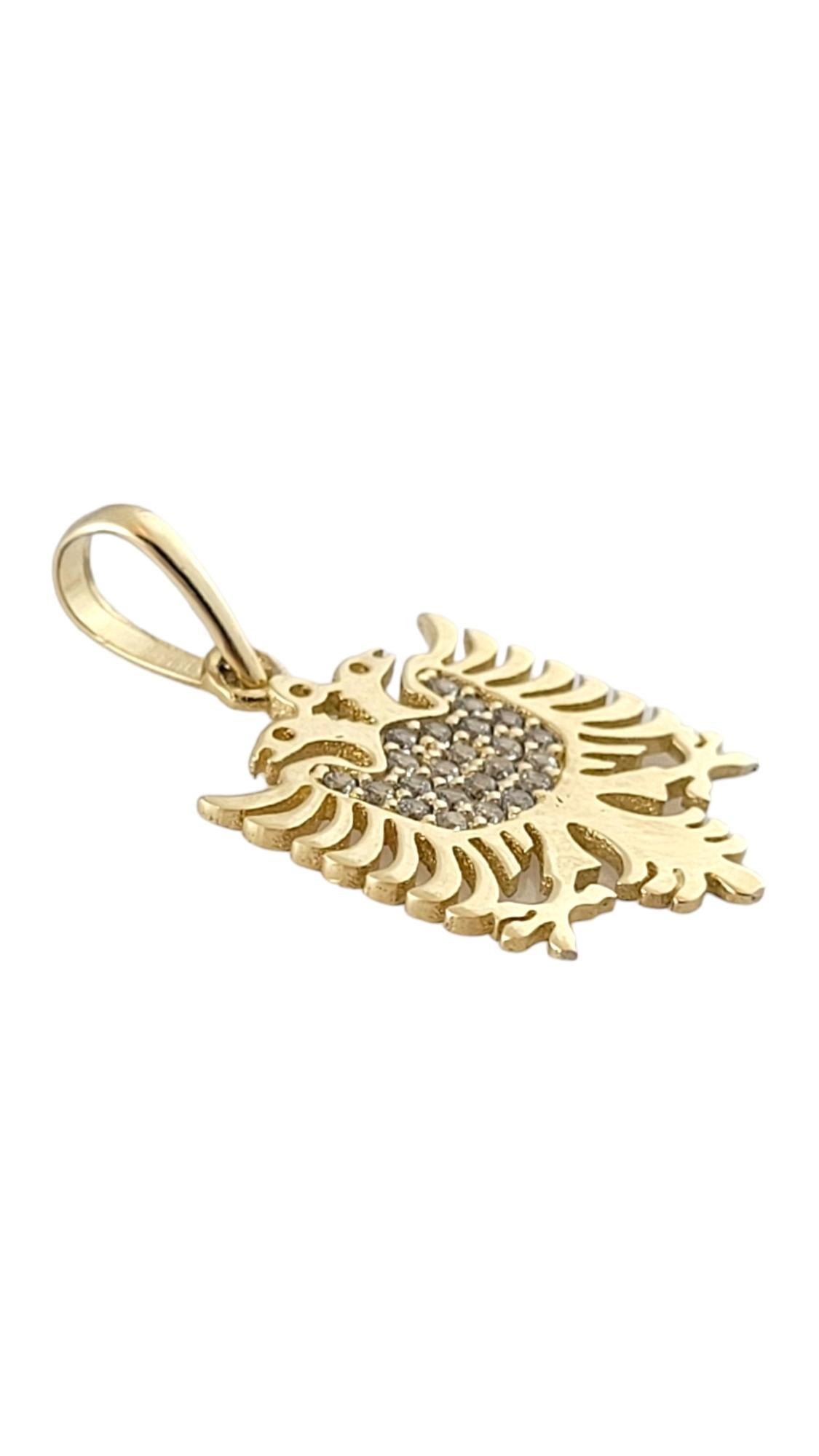 14K Yellow Gold Albanian Eagle Pendant 

This beautiful Albanian eagle pendant is crafted from 14K yellow gold and decorated with 23 sparkling clear stones!

Size: 22.27mm X 16.6mm X 1.08mm
Length w/ bail: 29.62mm

Weight: 1.47 dwt/ 2.29 g

Tested
