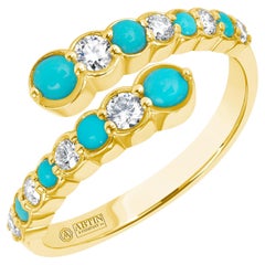 Bypass-Ringband aus 14 Karat Gelbgold mit abwechselnd Diamant und türkisfarbener Lünette 