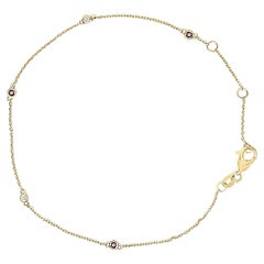 14K Yellow Gold Alternating Red Ruby and White Diamond Bezel Station Bracelet