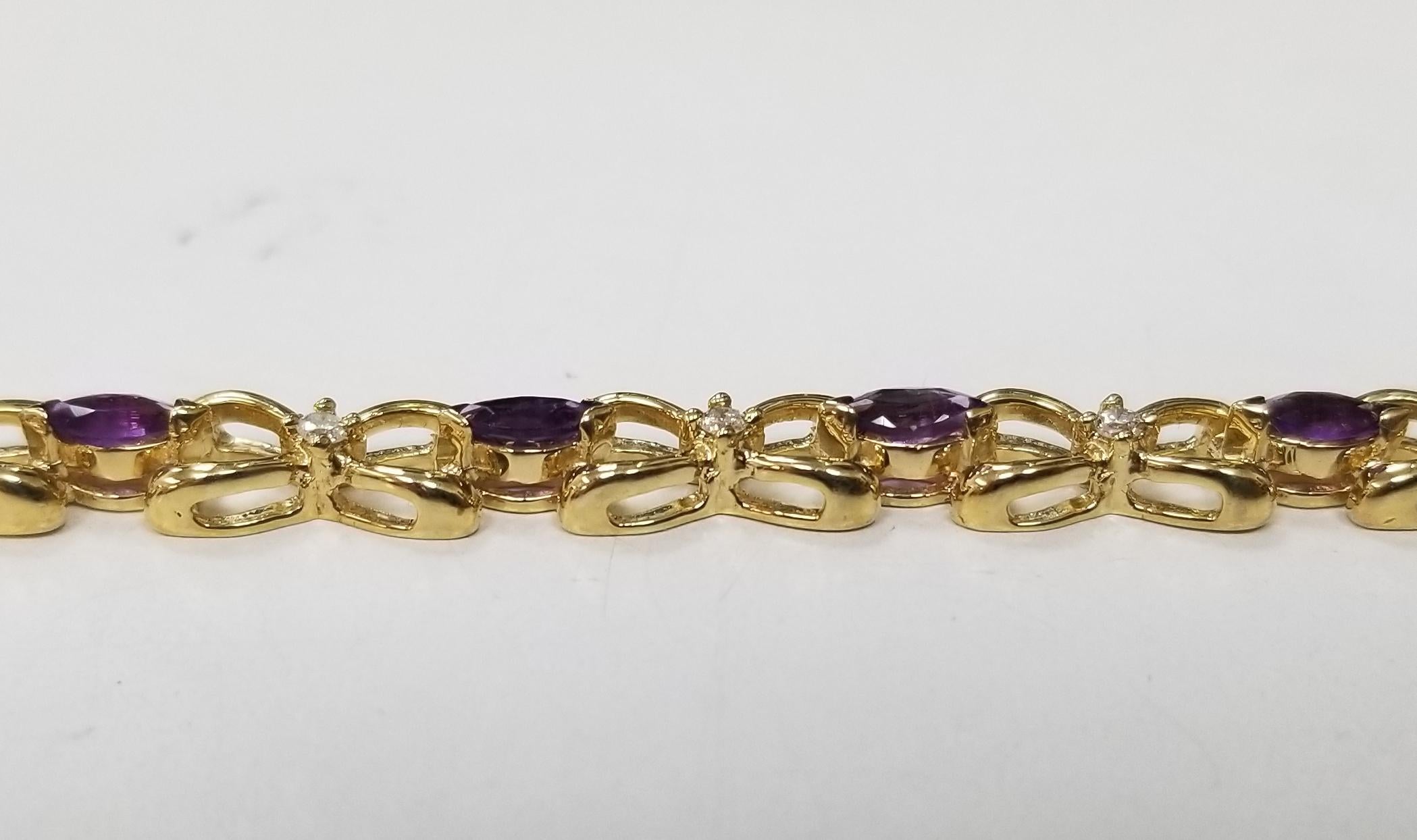 14k yellow gold amethyst and diamond bracelet, containing 12 marquise cut amethyst of gem quality weighing 1.75cts. and 12 round full cut diamonds; color 