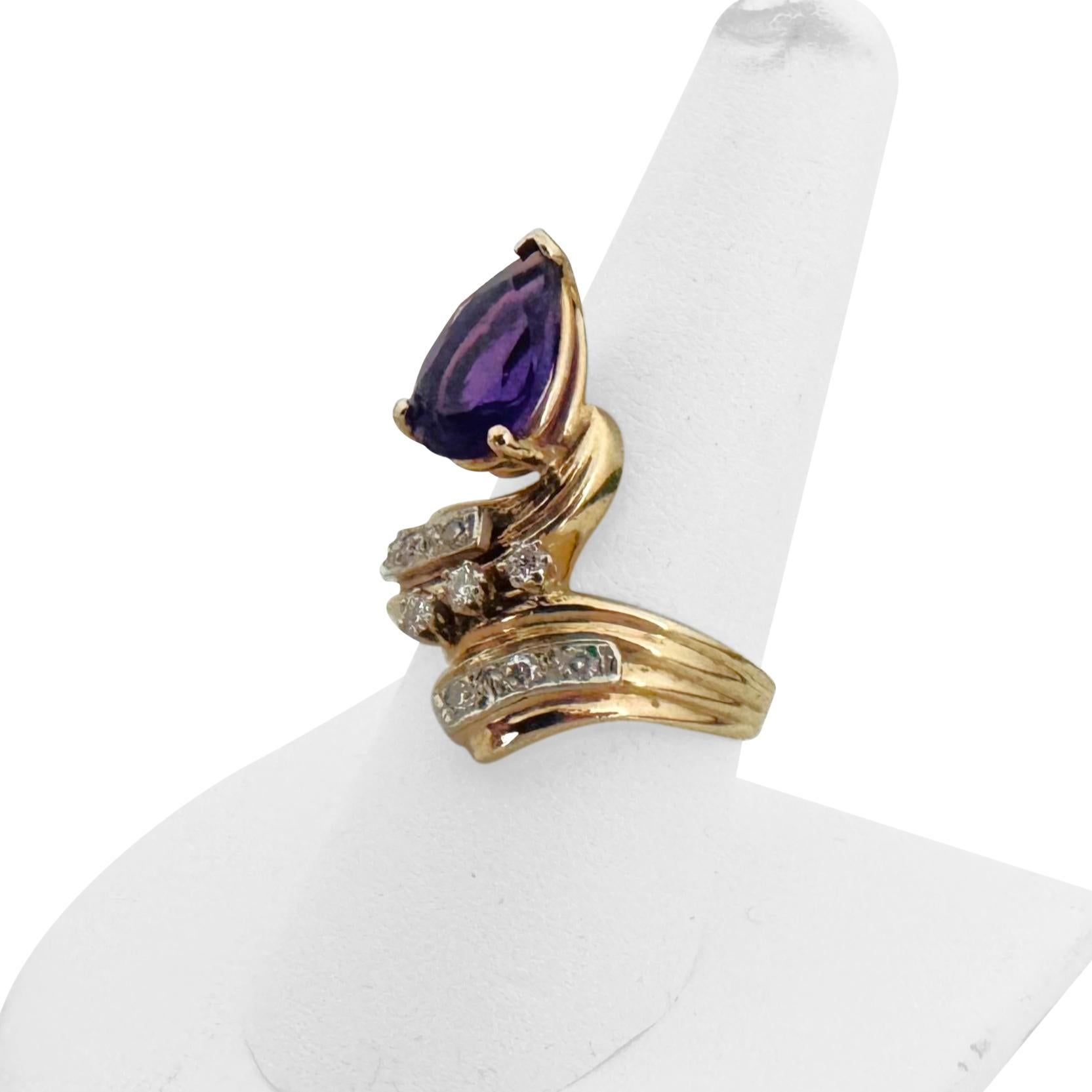 Condition:  Excellent Condition, Professionally Cleaned and Polished
Metal:  14k Gold (Marked, and Professionally Tested)
Weight:  8.2g
Gemstone:  Pear Cut Amethyst 13mm by 8mm
Diamonds:  Round Cut Natural Diamonds 0.12cttw
Face Measurements:  22mm