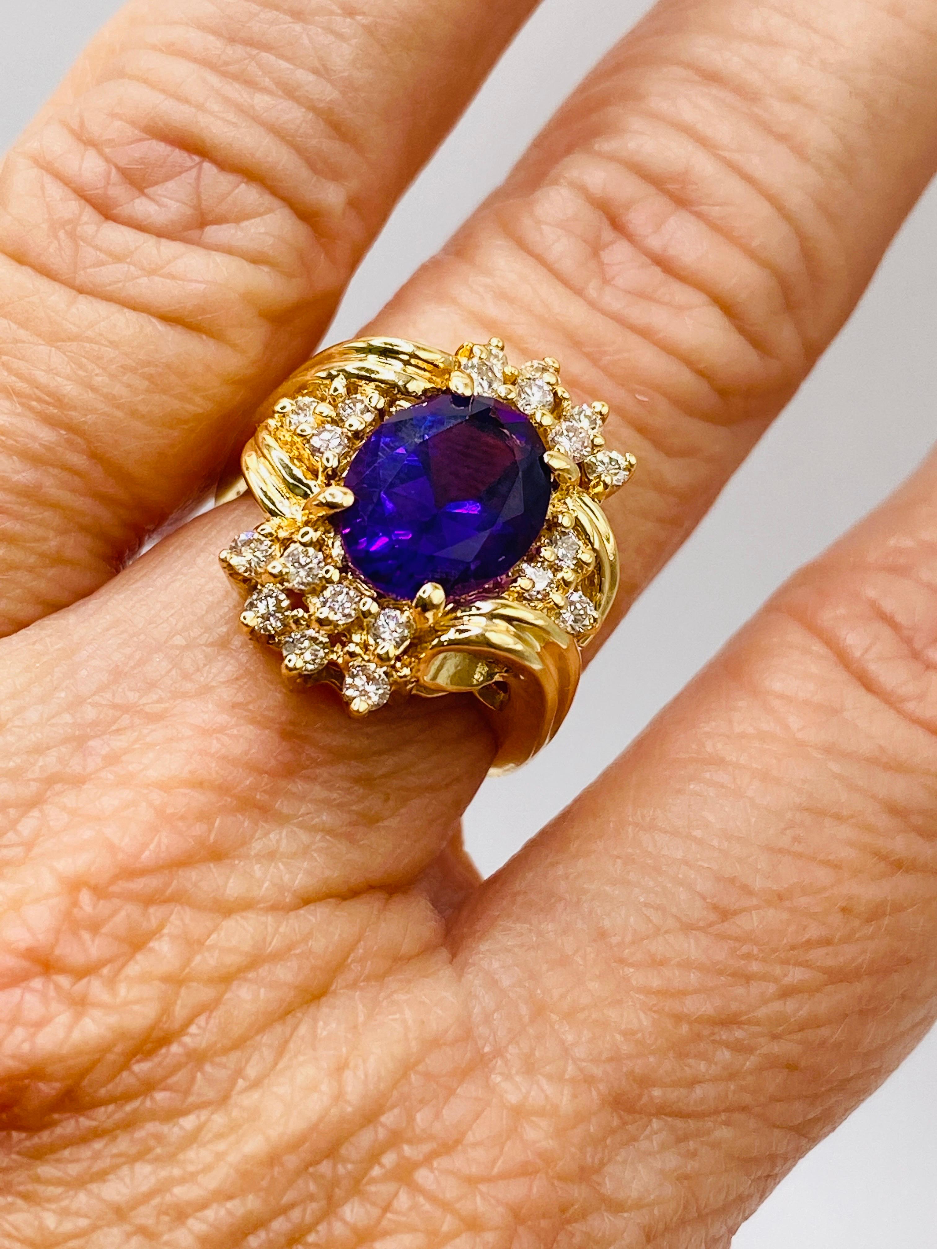 14k yellow gold ring with 1=oval amethyst and 20= round brilliant cut diamonds. Size 6.25, Dwt 5.3.