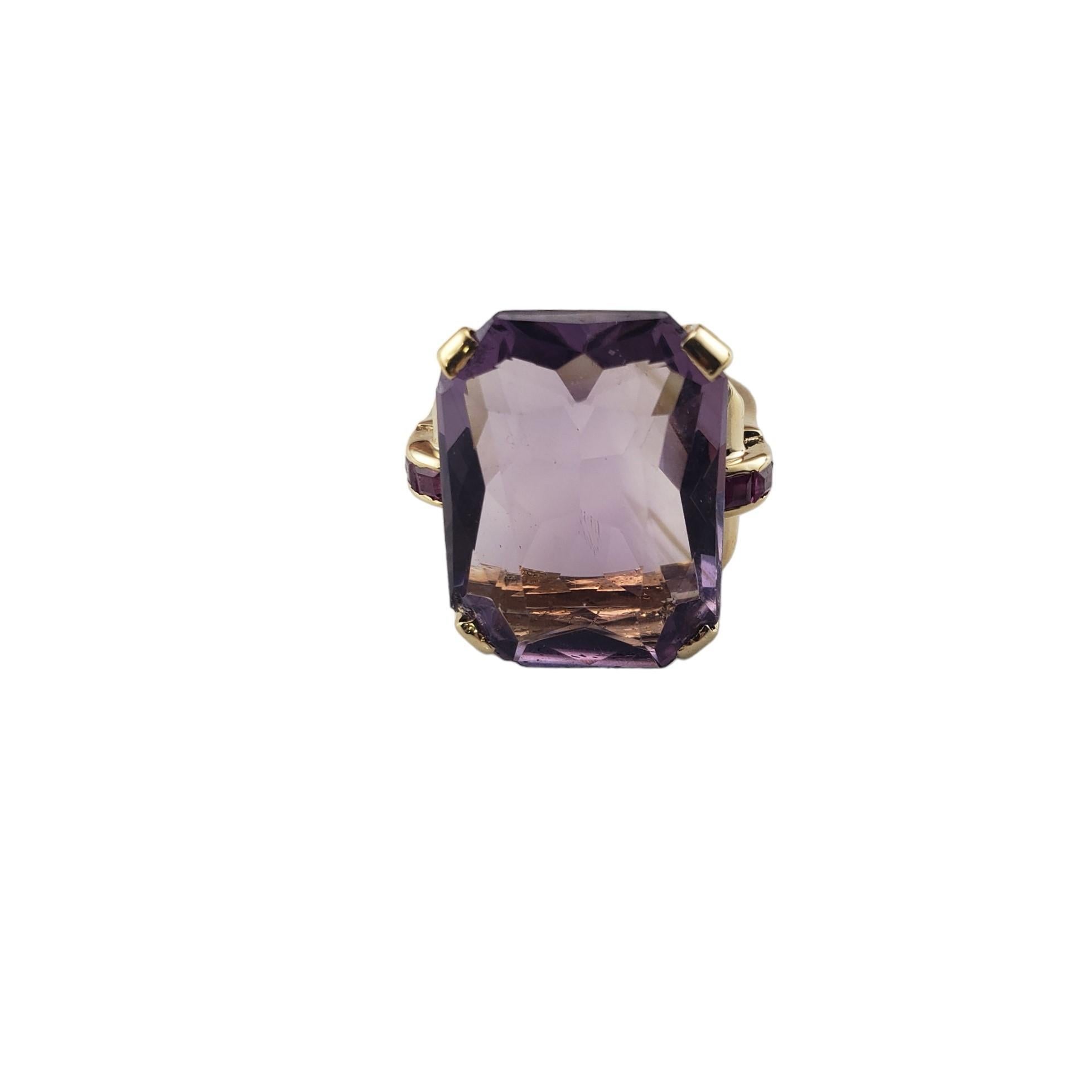 Vintage 14K Yellow Gold Amethyst and Rhodolite Garnet Ring Size 6.75 JAGi Certified-

This elegant ring features one radiant shaped cut amethyst 920 mm x 14.9 mm) and six square cut rhodolite garnets set in classic 14K yellow gold.  Shank: 2.1