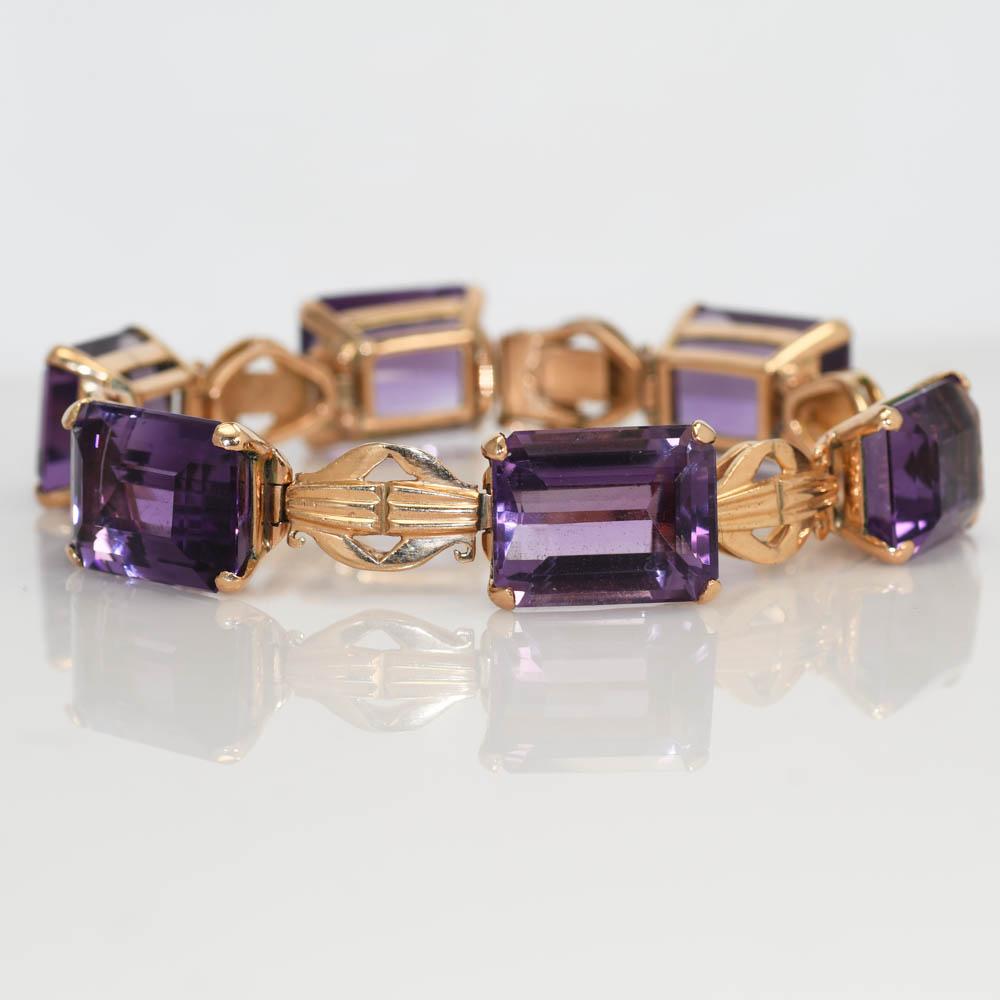 14k Gelbgold Amethyst-Armband
Es gibt über 80tcw in Smaragdschliff Amethyst. 
585 auf der Schließe gestempelt
Maßnahmen 7in
Wiegt 23.2gr