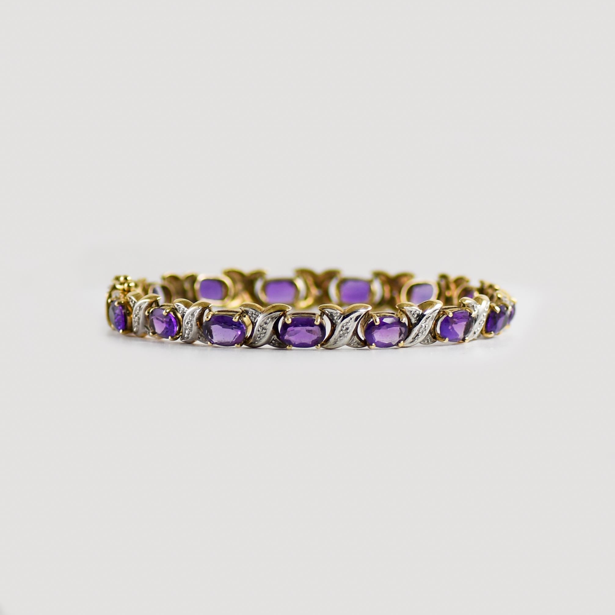 14K White Gold Amethyst & Diamond Bracelet.
Stamped 14k and weighs 13 grams.
The amethyst stones are oval-shaped and are a fine medium purple color.
There are nine small round diamonds in between the amethysts, .09 total carats.
The bracelet