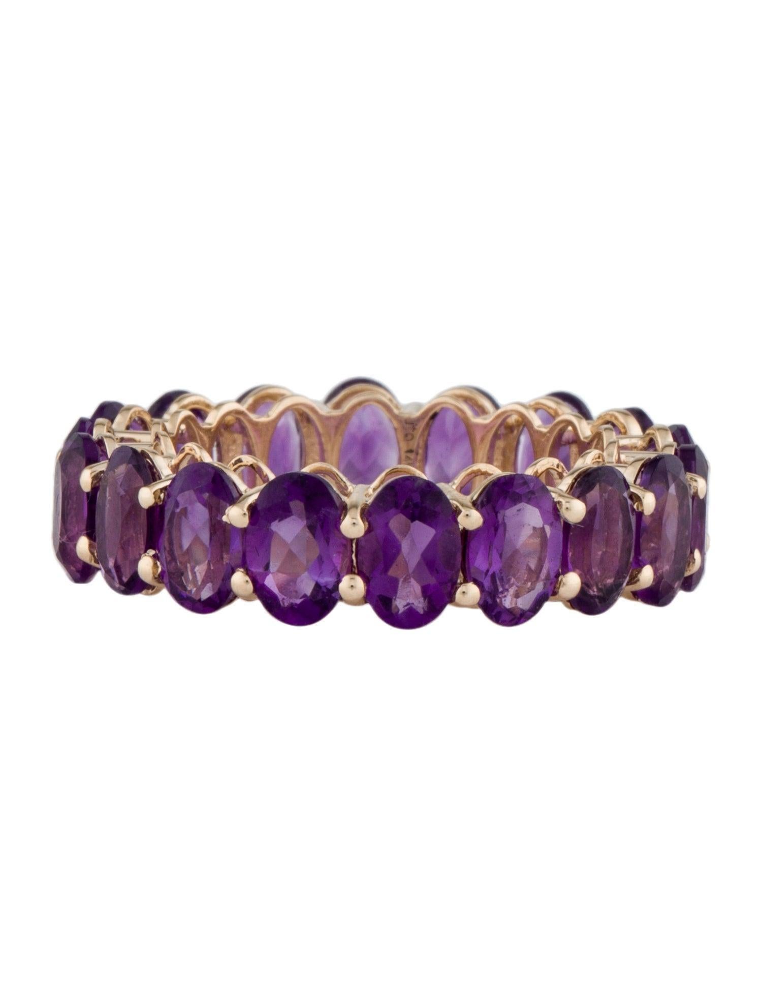 Embrace the captivating beauty of our 14K Yellow Gold Amethyst Eternity Band, a luxurious statement of elegance and sophistication. Sized at 7, this exquisite ring features a total carat weight of 7.05 in oval brilliant amethysts, encircling the