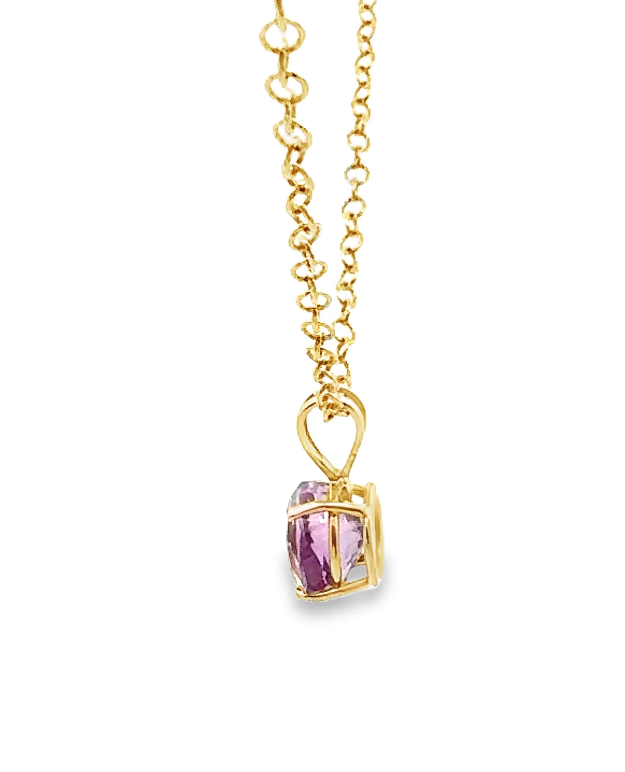 14K yellow gold pendant furnished with one round faceted light purple amethyst measuring at 9.5mm. The pendant slides on a 14K yellow gold open link chain, 16 inches long.

*Lobster lock closer