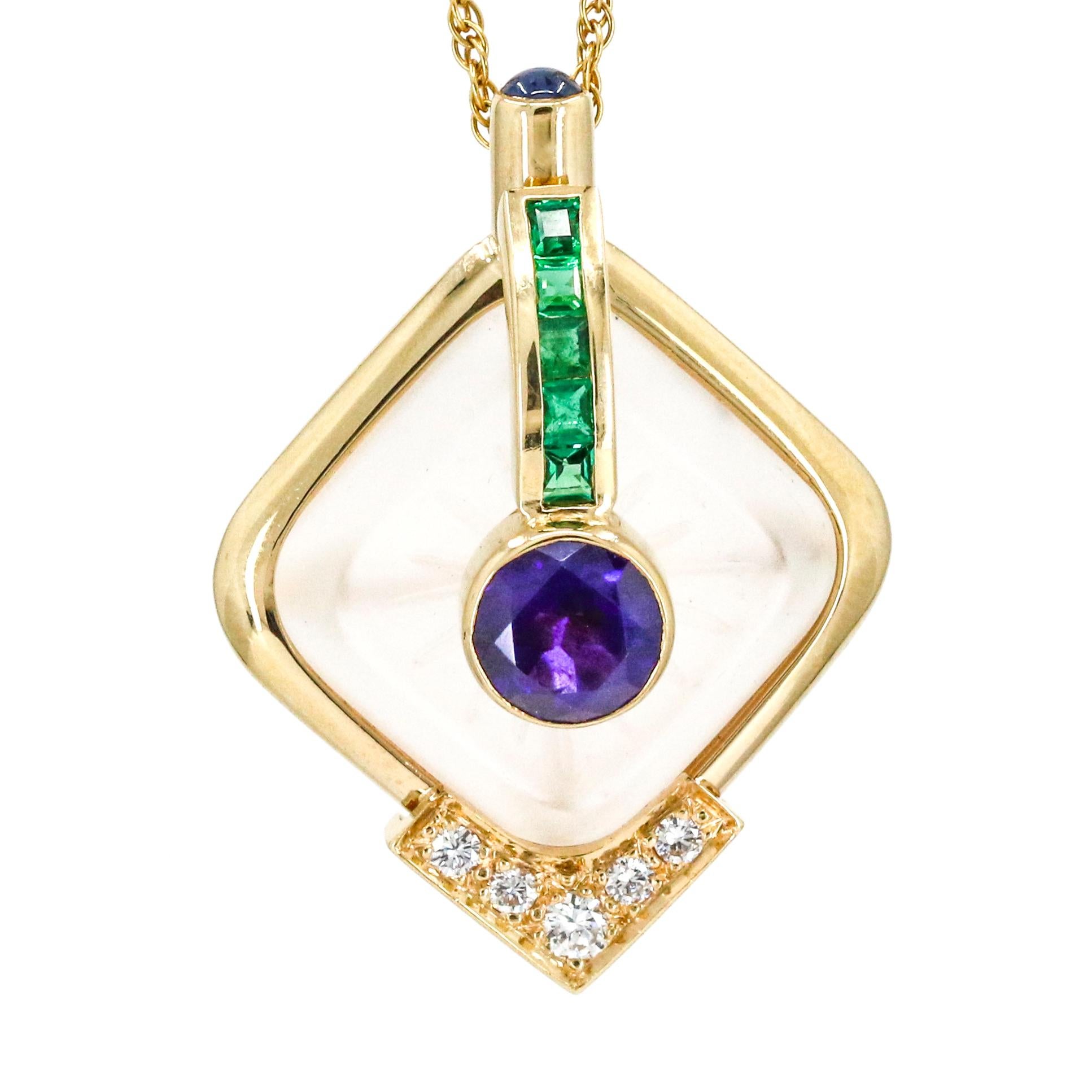 Quartz, diamond, amethyst, and emerald pendant necklace in 14-karat yellow gold. The pendant has a bezel set round-cut amethyst at the center of a carved white quartz. The quartz is bezel set in a polished gold setting with 5 prong set round