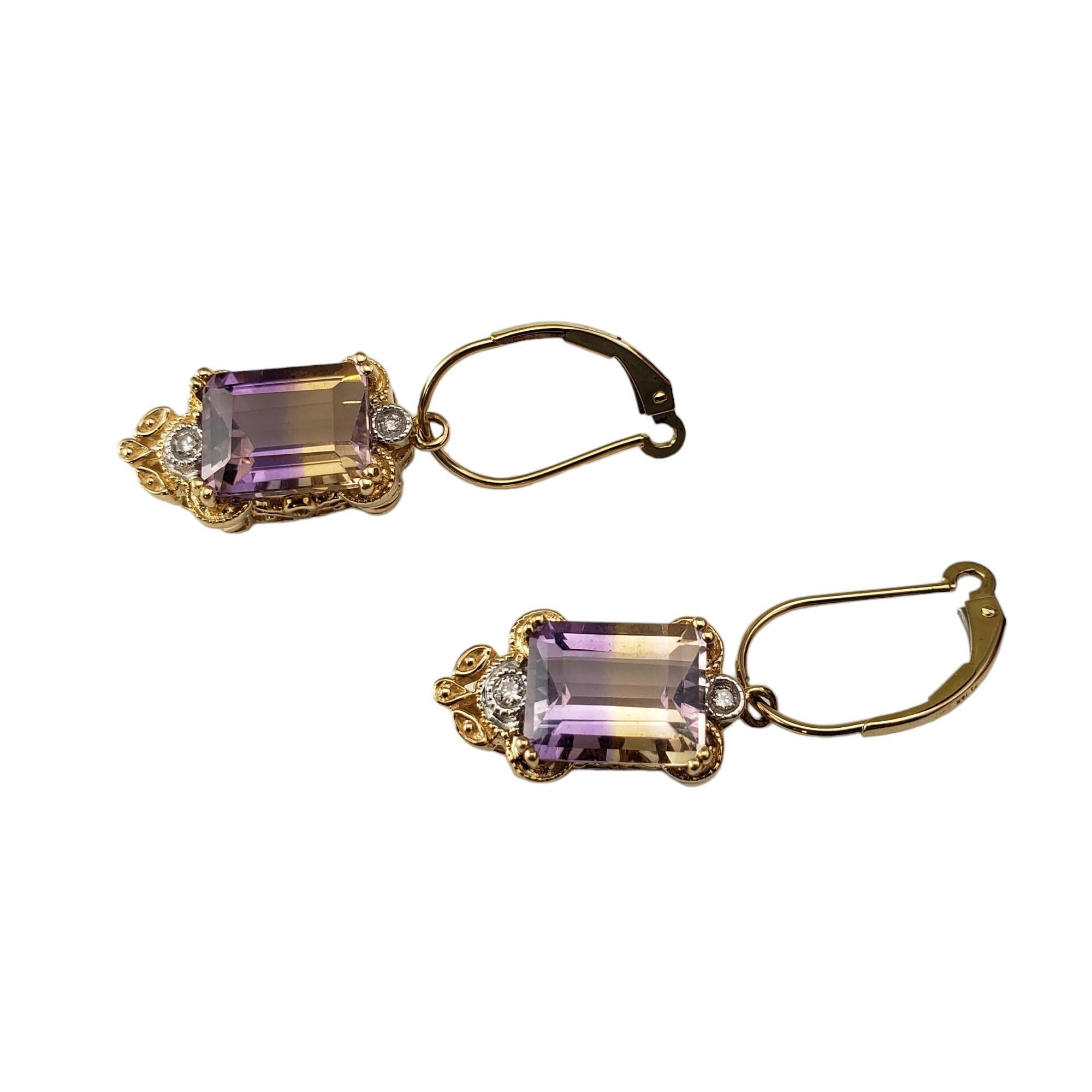 14 Karat Yellow Gold Ametrine and Diamond Dangle Earrings JAGi Certified-

These lovely dangle earrings each feature one emerald cut ametrine quartz stones (10.2 mm x 8 mm) and two round brilliant cut diamonds set in classic 14K yellow gold. 