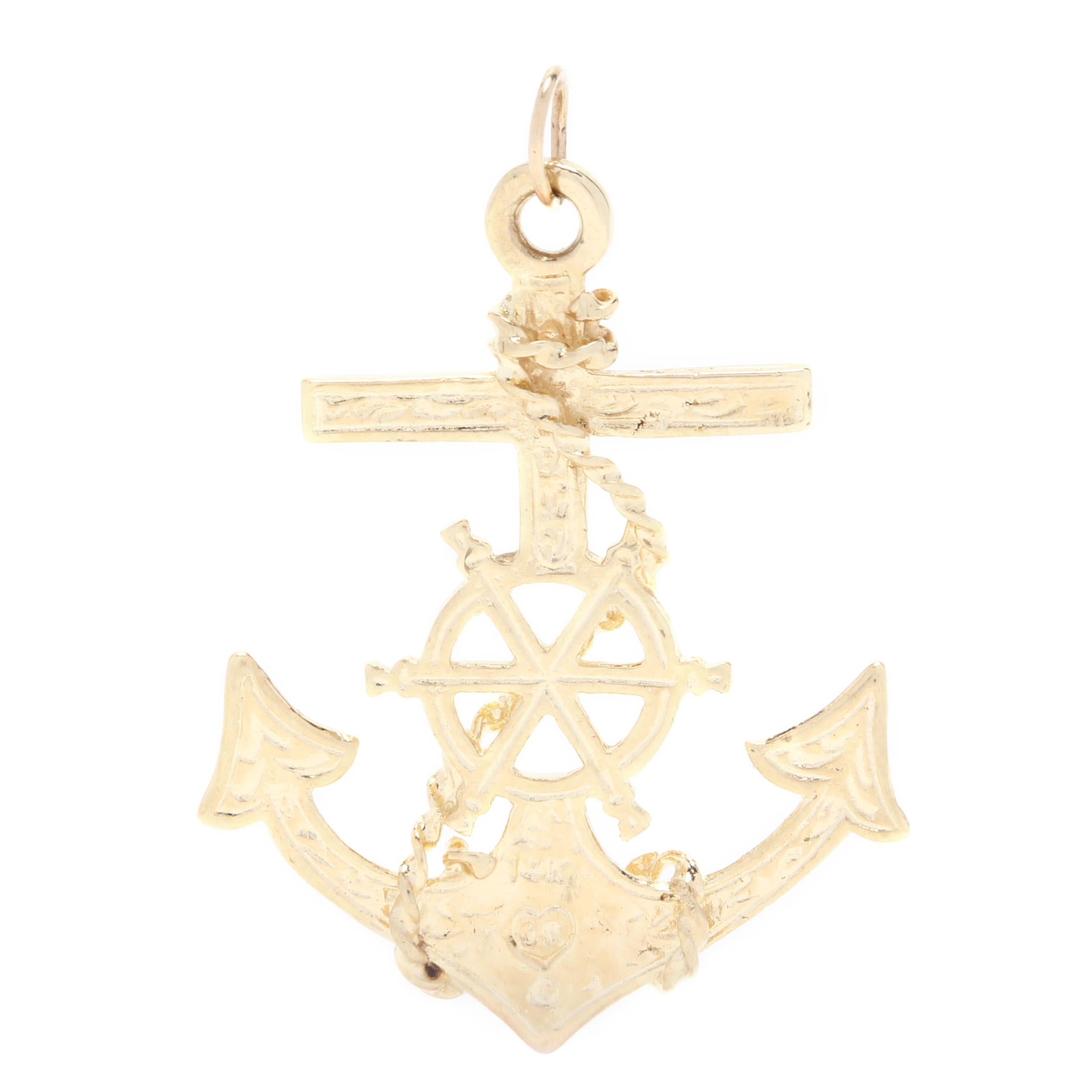 A 14 karat yellow gold anchor charm / pendant. This pendant features an anchor motif with a center wheel and a rope motif coiled throughout.

Length: 1 1/8 in.

Width: 3/4 in.

1.37 dwts.

* Please note that this is a vintage item and may show signs