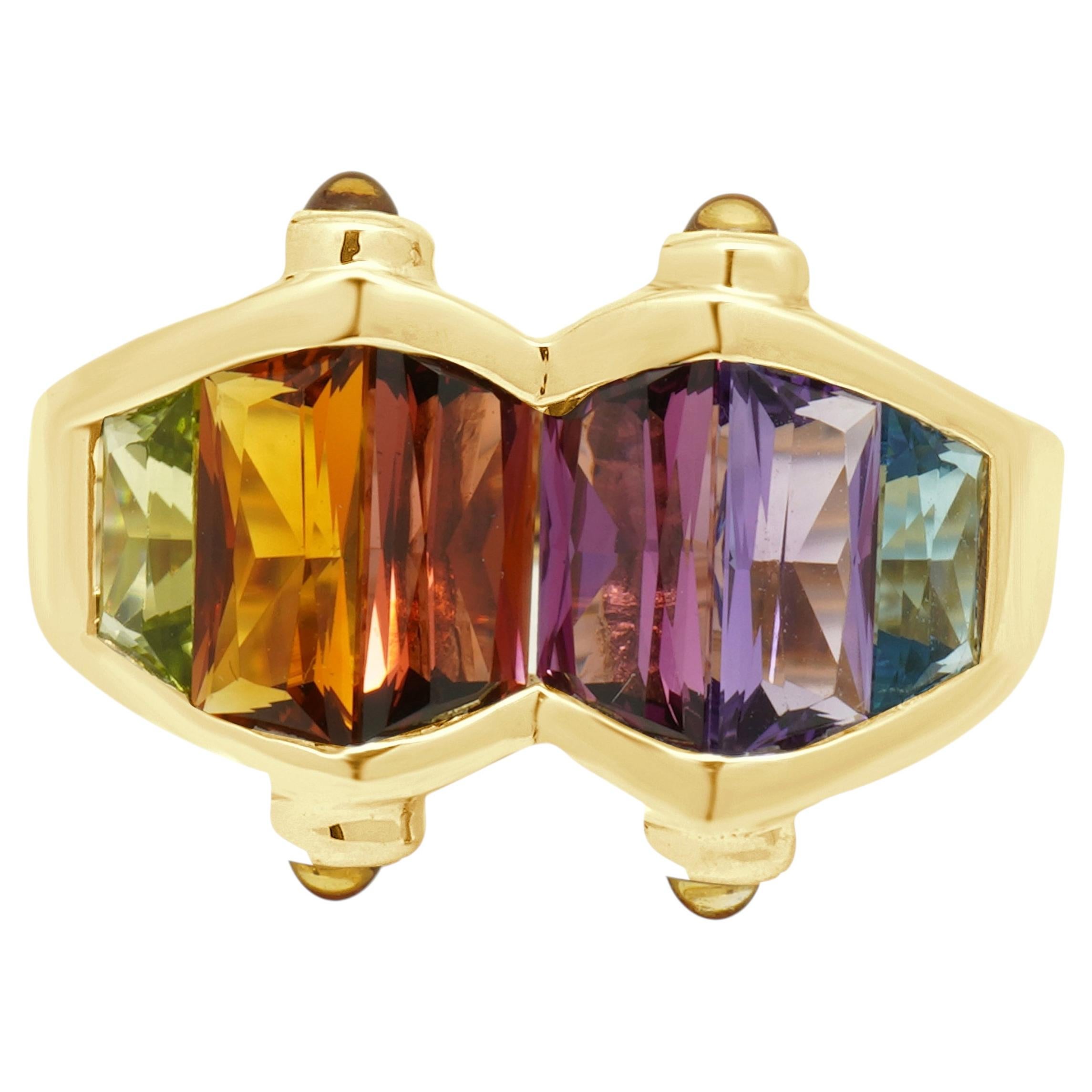 Anillo de oro amarillo de 14K con piedras preciosas multicolores engastadas en canal