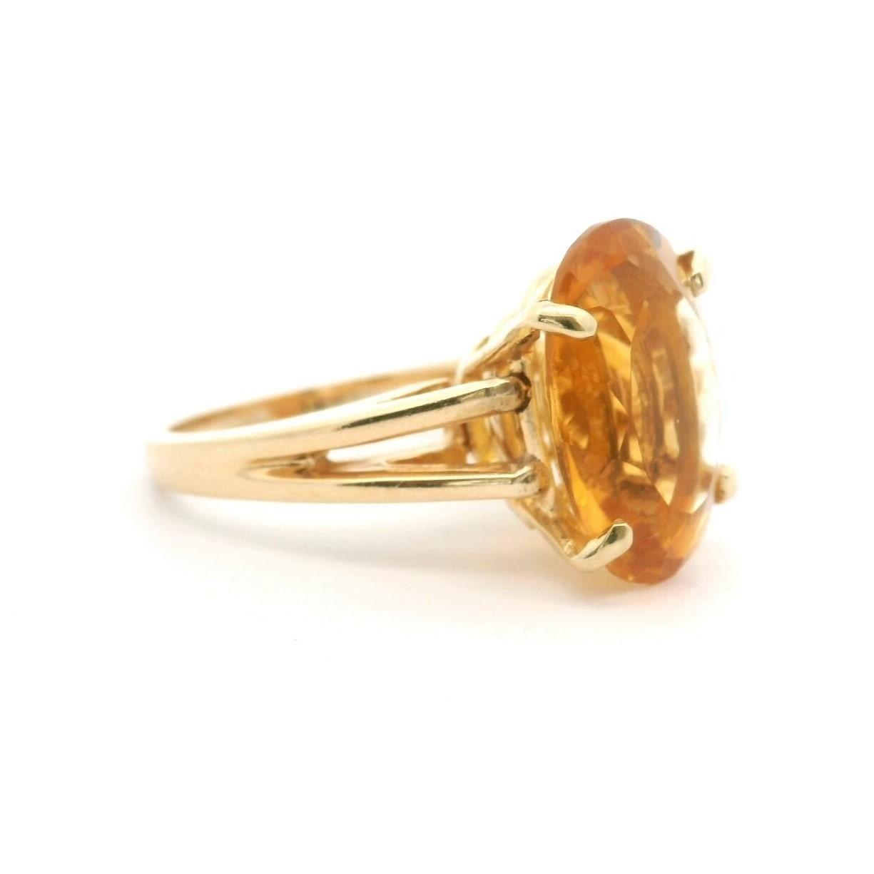 Condition:  Excellent Condition, Professionally Cleaned and Polished
Metal:  14k Gold (Marked, and Professionally Tested)
Weight:  7.8g
Gemstone: Oval Cut Citrine 16mm by 12mm  
Band Width:  2mm
Size: 7.5
Markings:  