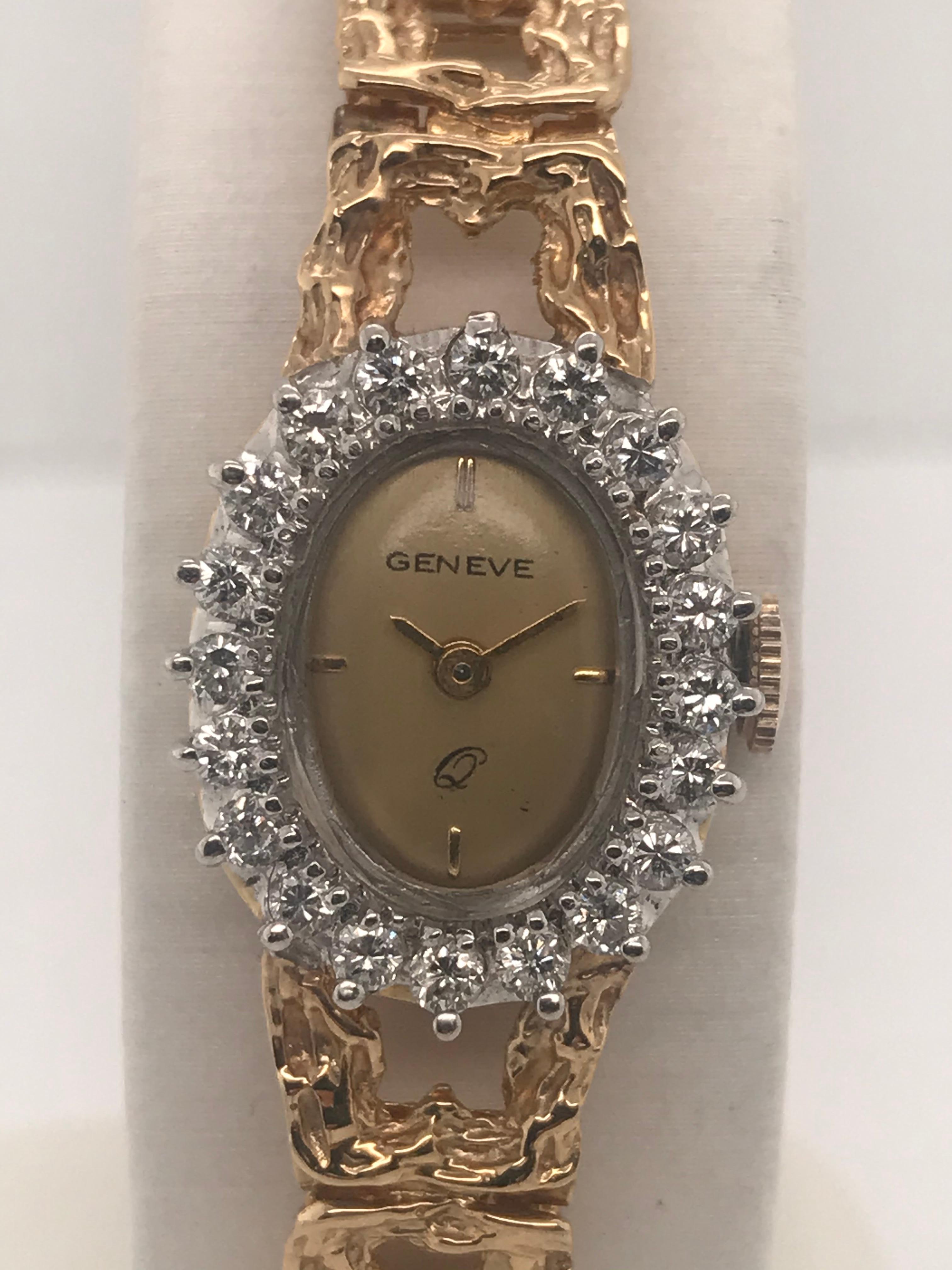 This elegant timepiece can be worn for any occasion!  It is dazzled with 20 round brilliant diamonds encasing the oval bezel with a total weight of approximately 0.60cts.  It has an integrated yellow gold bark style bracelet with hidden box style