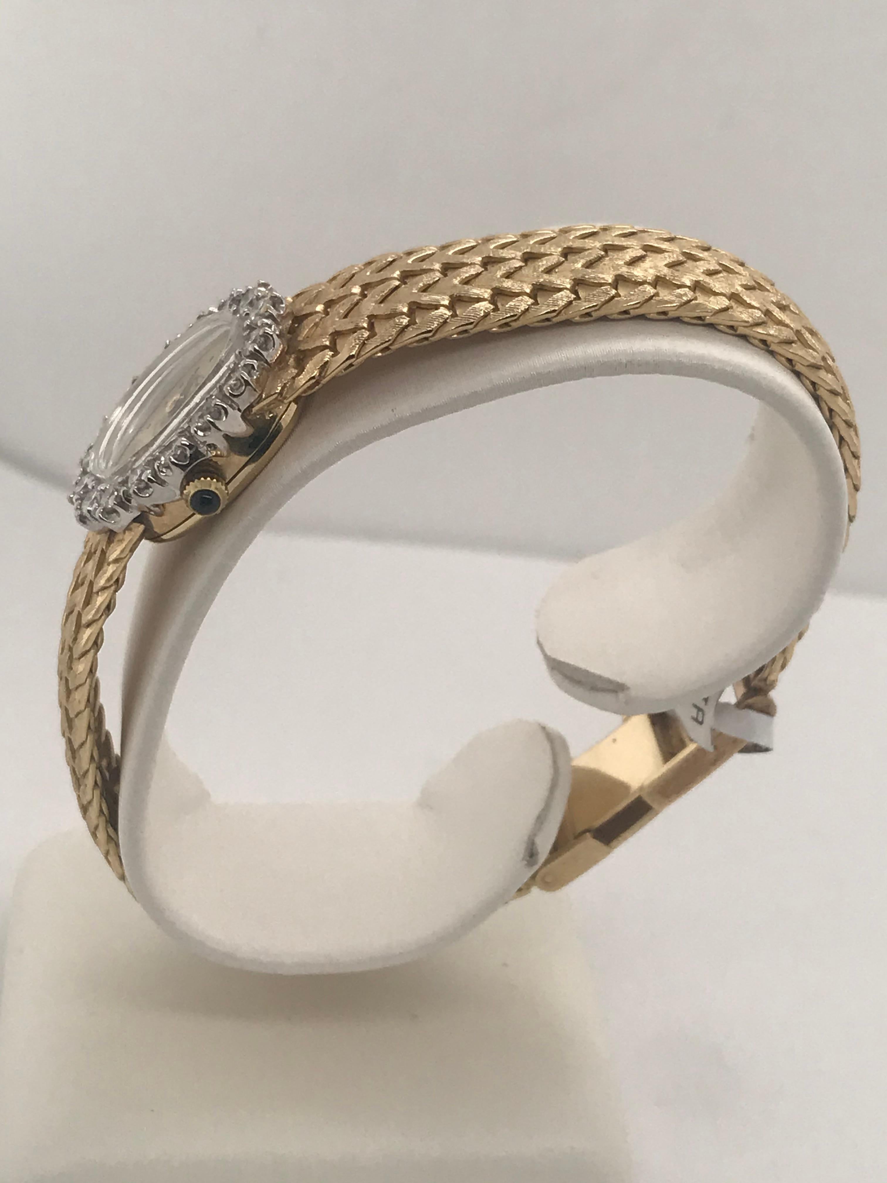 This beautiful Jules Jurgenson 14k  yellow gold watch has 1.00 carat total diamond weight and a very accurate quartz movement.  It has a 2 row chevron bracelet with a easy on-easy off fold over clasp.  It has a timeless elegant design that will