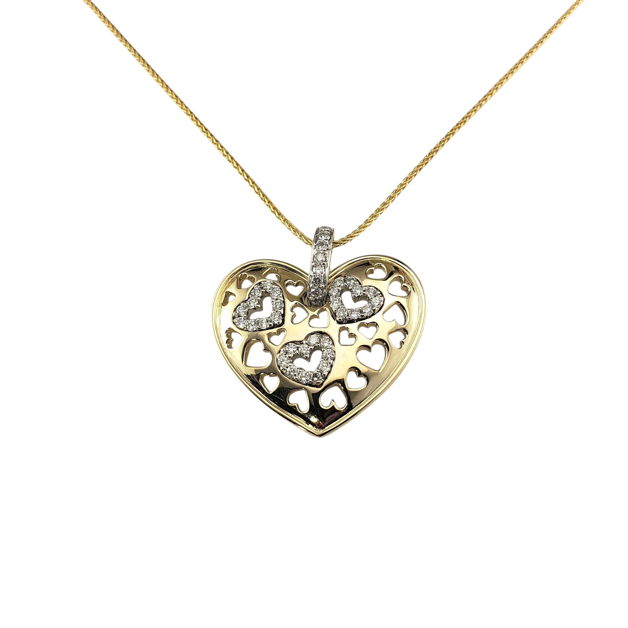 14K Yellow Gold and Diamond Heart Pendant Necklace-

This lovely heart pendant features 39 round brilliant cut diamonds set in beautifully detailed 14K yellow gold. Suspends from a matching 14K gold chain. A romantic and elegant look that is perfect