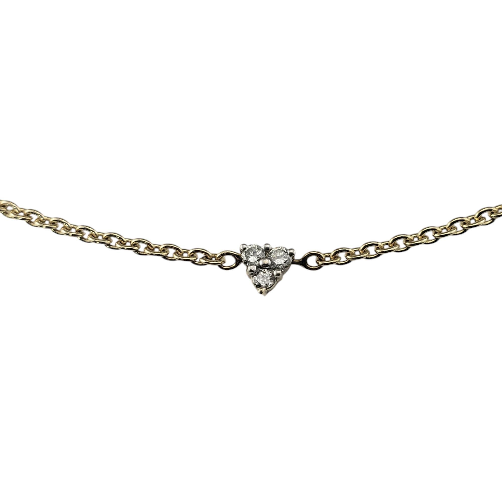 14K Yellow Gold and Diamond Station Necklace-

This delicate yet dazzling 14K yellow gold necklace features three sparkling diamonds and each station for a beautifully balanced look, the perfect blend of sophistication and everyday