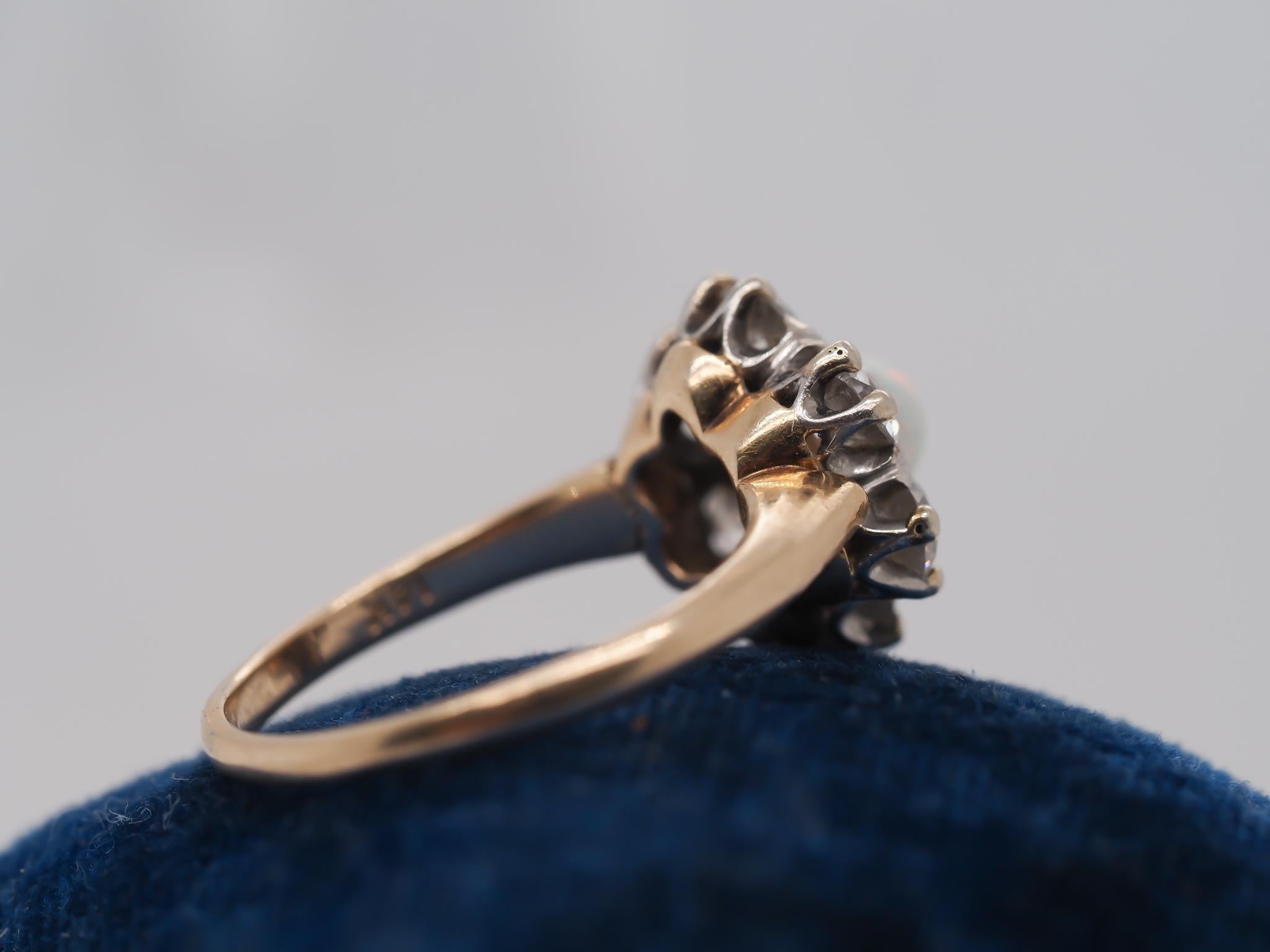 14K Yellow Gold and Platinum Edwardian Opal and Old Mine Diamond Halo Ring In Good Condition For Sale In Hicksville, NY