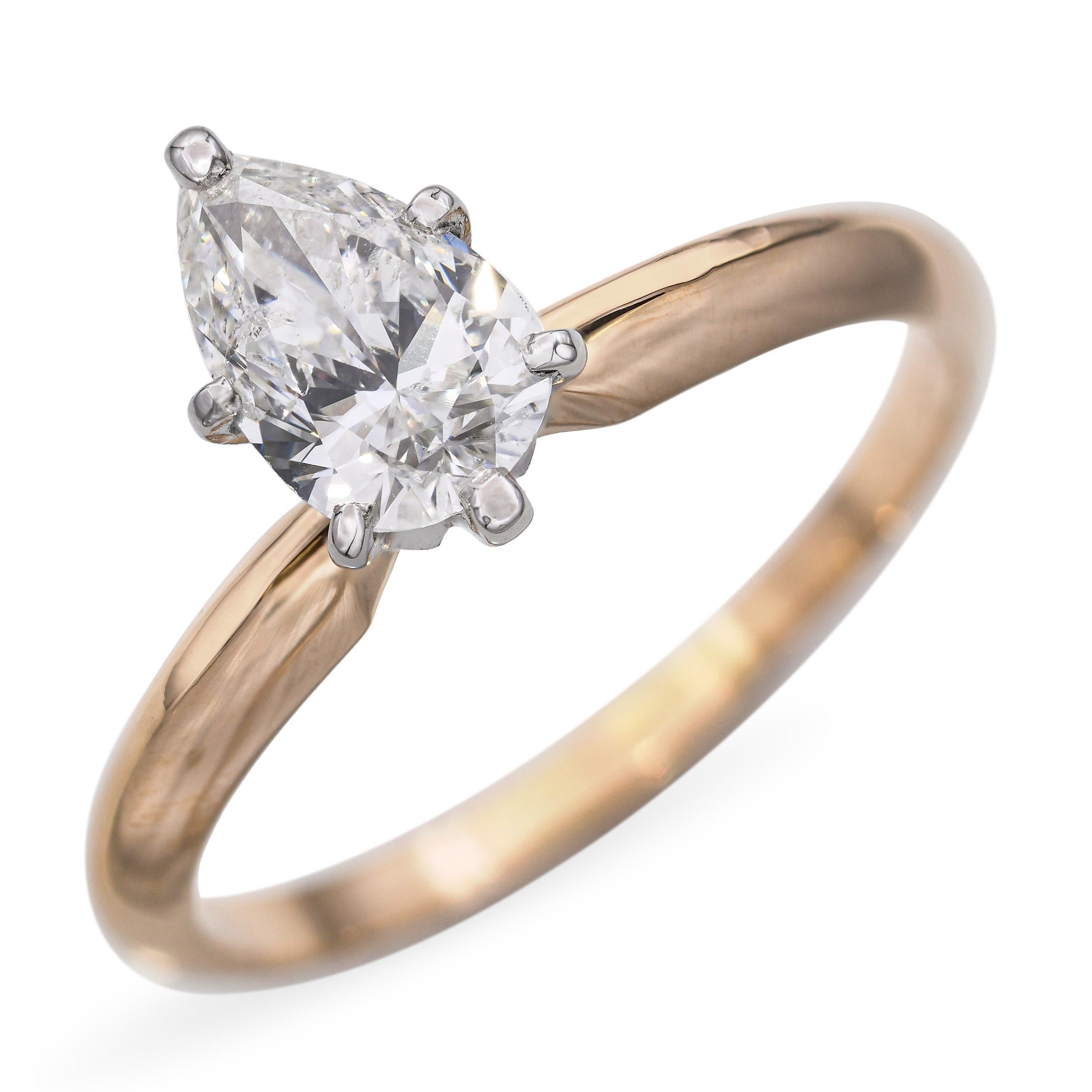 Anillo de diamantes vintage de oro amarillo de 14k y platino con certificado GIA G I1 de 0,76 quilates, con un hermoso diamante tallado en forma de pera de 0,76 quilates. El diamante tiene una graduación G de color e I1 de claridad, y ofrece un