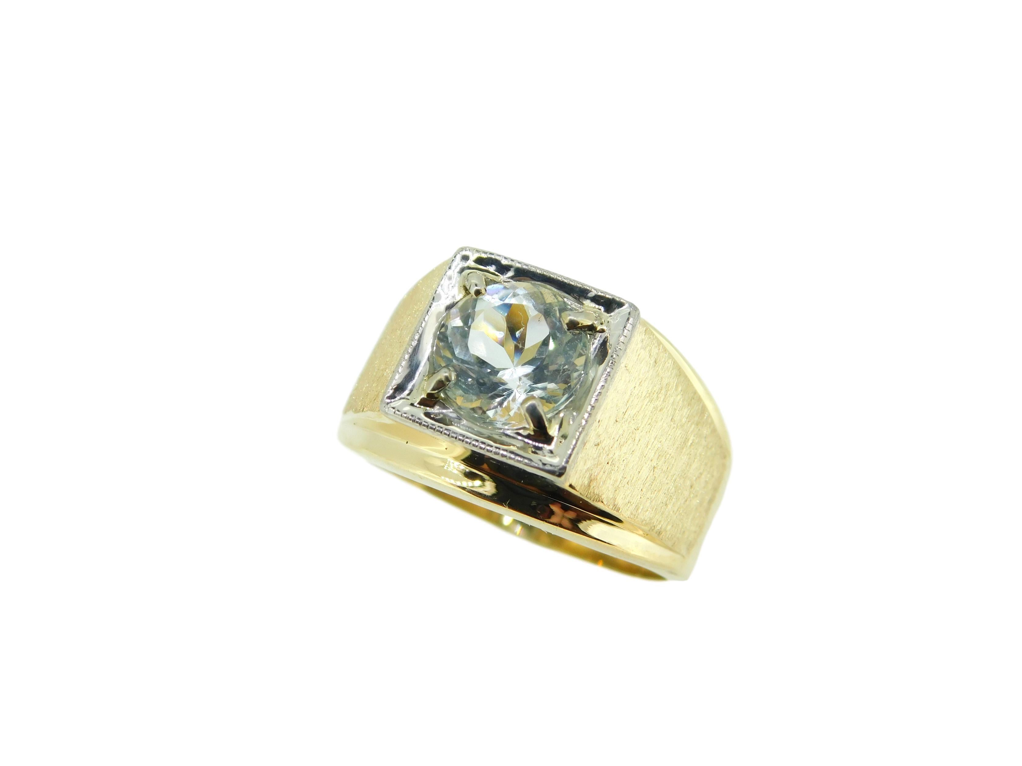 14k Yellow Gold and Platinum Men's Genuine Natural Aquamarine Ring (#J4724)

14k yellow gold men's ring with a platinum head set with a pale icy blue round aquamarine. The aqua weighs 2.26 carats and measures about 8.3mm. The sides of the band have