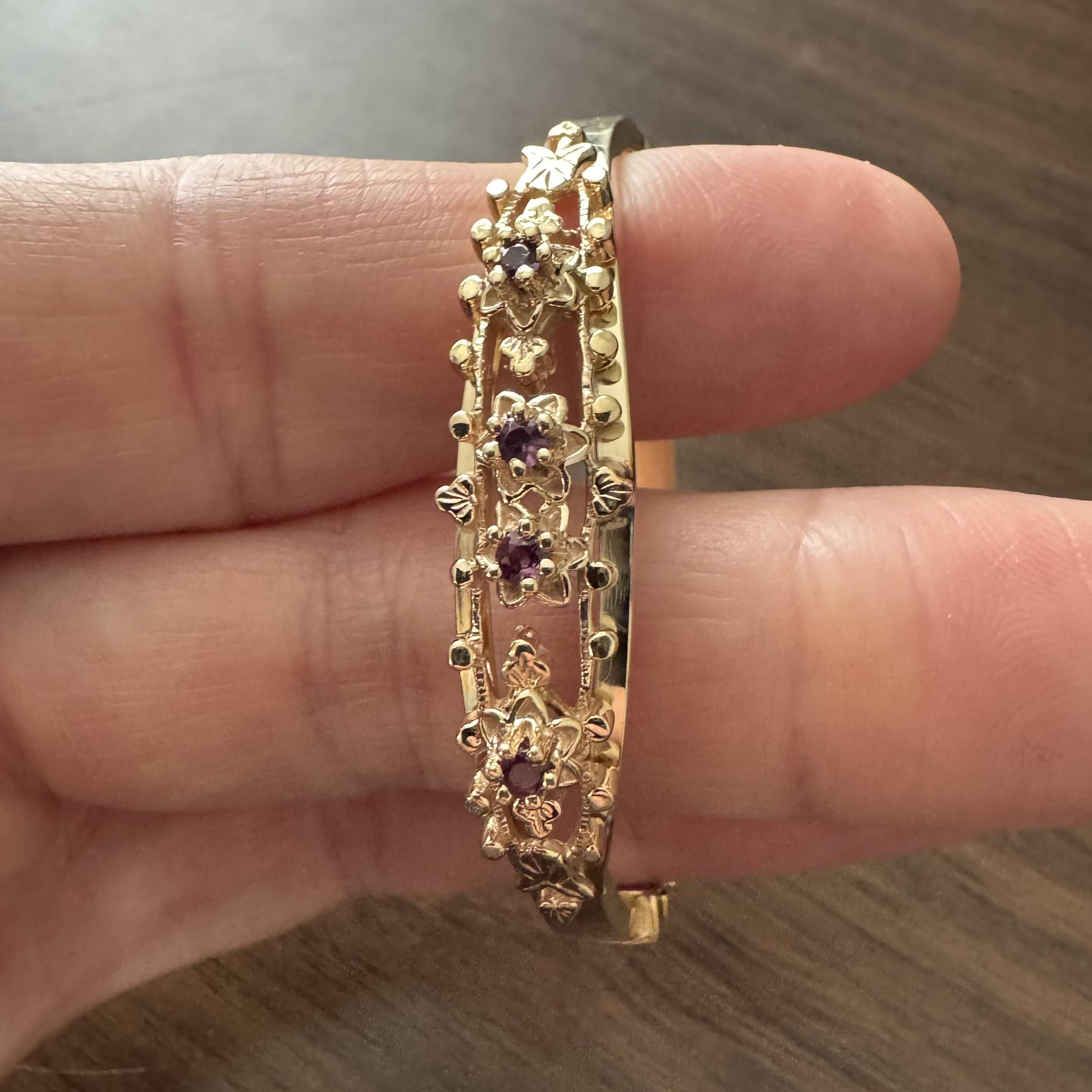 Condition:  Excellent Condition, Professionally Cleaned and Polished
Metal:  14k Gold (Marked, and Professionally Tested)
Weight:  12.1g
Gemstones:  Four Round Cut Rubies
Length:  6.25 Inches Inner Circumference
Width:  10mm at widest, 4.5mm at