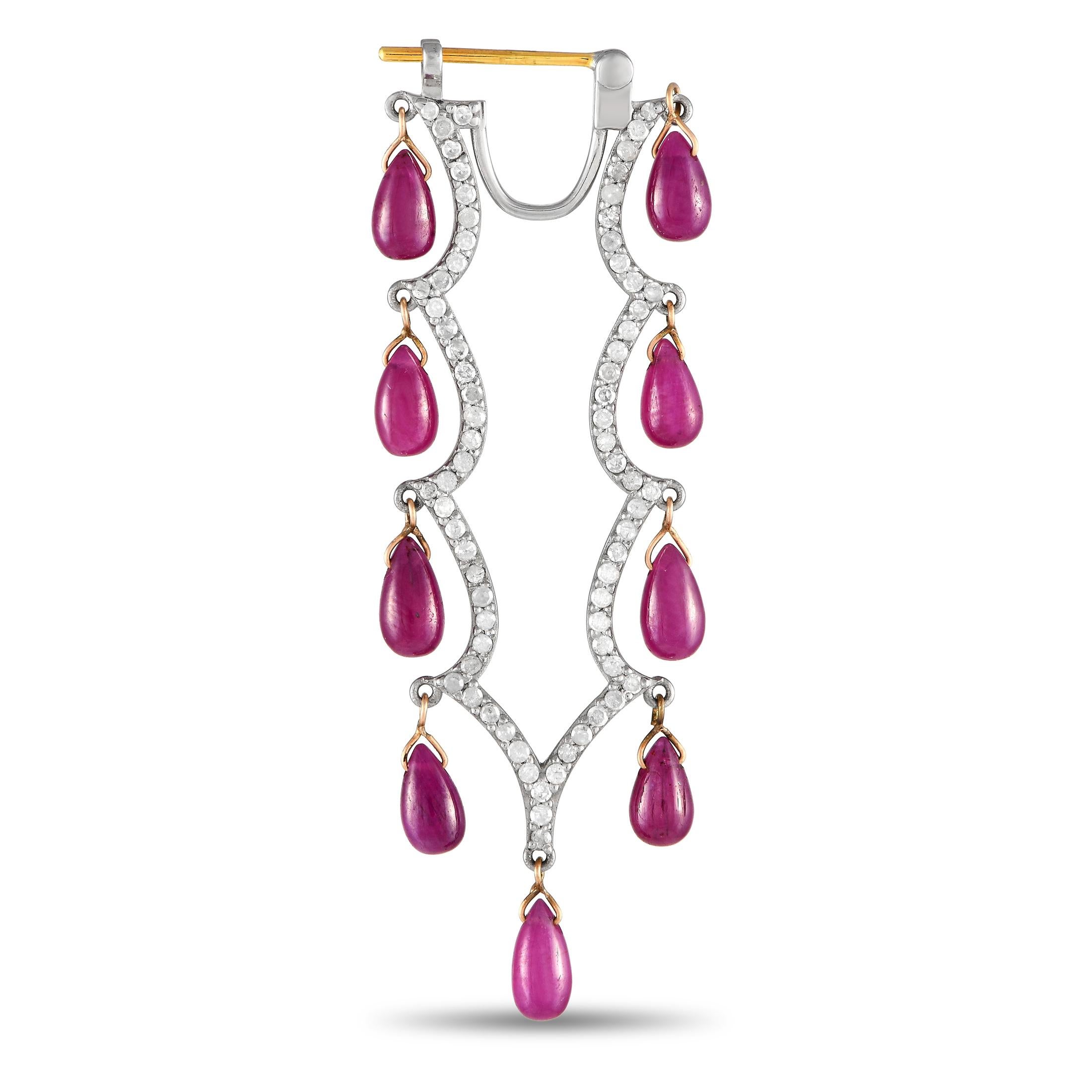 These dramatic earrings are exquisite from every angle. Opulent 14K Yellow Gold and Silver are beautifully juxtaposed on each earring, creating a subtle two-toned design. Pear-cut Ruby gemstones with a total weight of 15.20 carats dangle gracefully