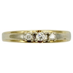 Bague à trois pierres en or jaune et or blanc 14 carats