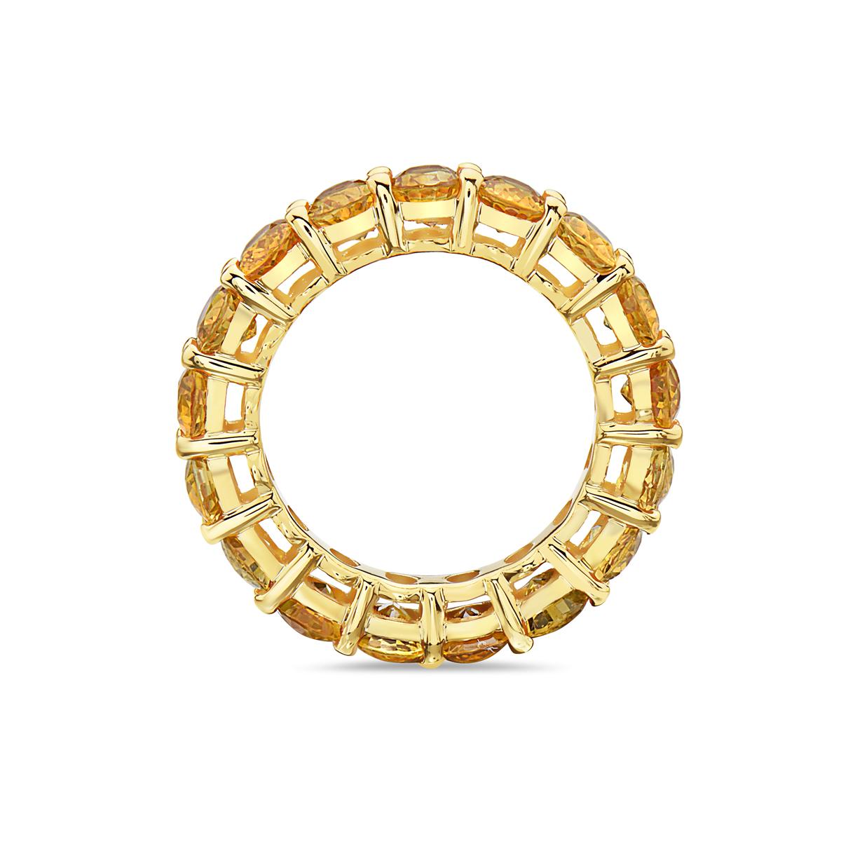 This eternity band ring features 17 oval cut yellow sapphires weighing 7.90 carats set in 14K yellow gold. Weighing 5.7 grams. Size 6.