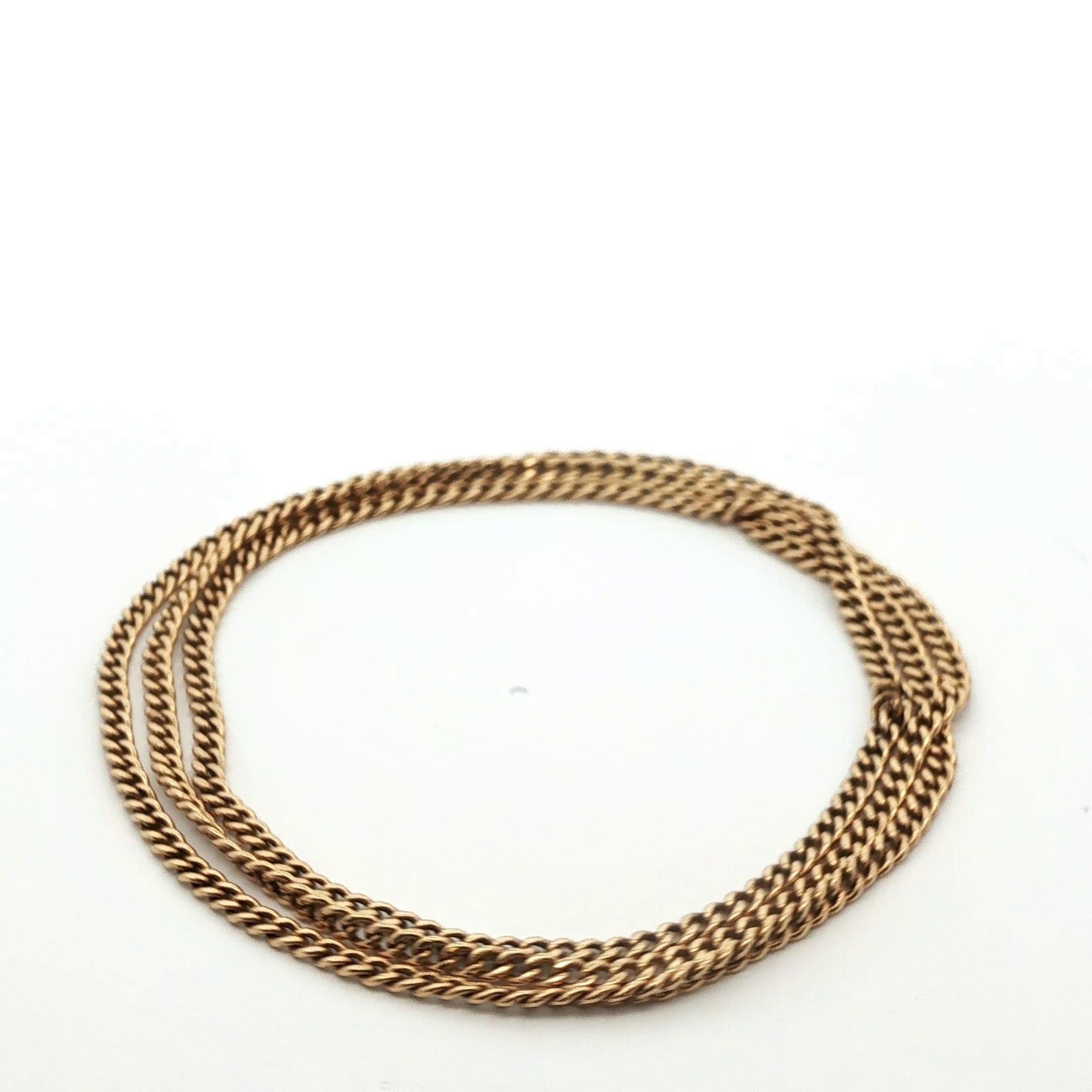 This antique curb link chain is made in rich 14k yellow gold and comes from the early 1900s. This chain is continuous and does not feature a clasp or lock. This creates a sleek and clean chain that symbolizes eternity and represents an unbroken