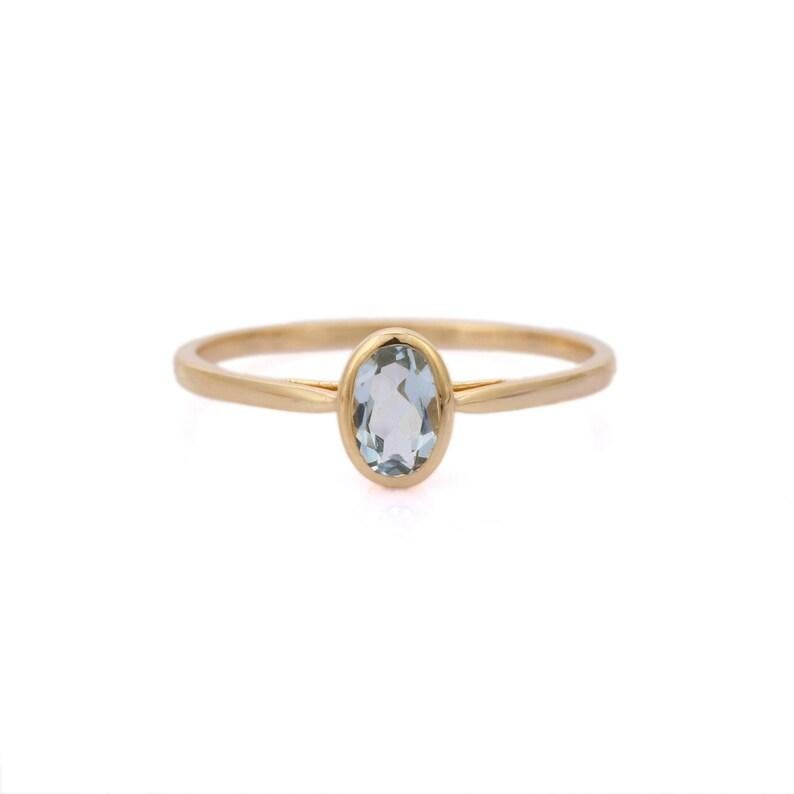 Dainty Aquamarine Ring in 14K Gold featuring natural aquamarine of 0.39 carats. The gorgeous handcrafted ring goes with every style, every occasion or any outfit. To enhance your look and convey your emotions, stack your rings.
Aquamarine is useful