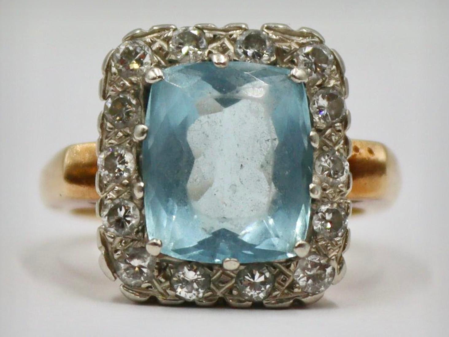 14k yellow gold aquamarine and diamond ring, 6.78 Grams TW.  Approximately 5 carats aquamarine gemstone and approximately 1.5 Diamonds TCW. Marked 14k. Approximate size 6.0.