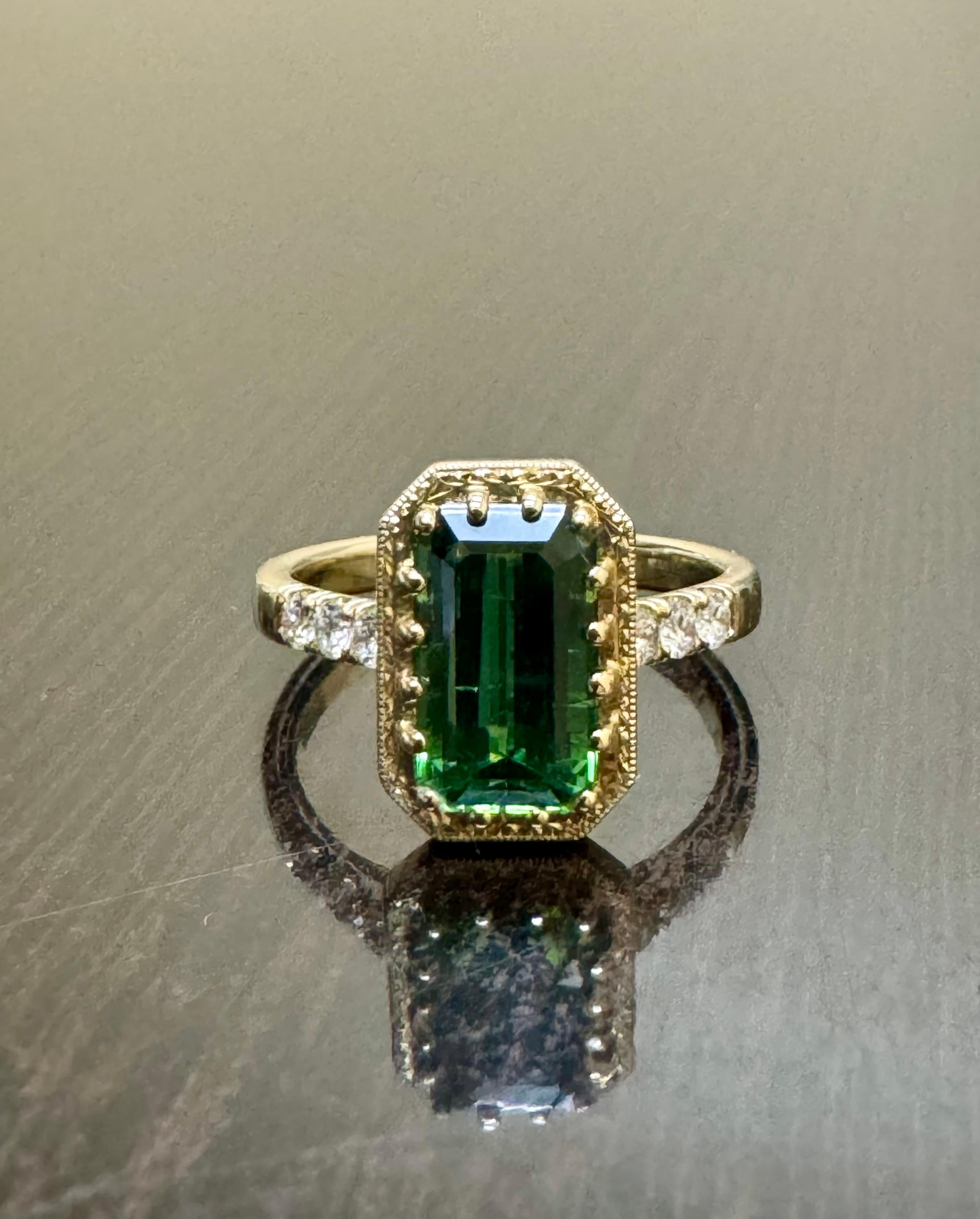 DeKara Designs Collection

Our latest design! An Elegant and Lustrous Elongated Emerald Cut Teal Tourmaline Handmade in 14K Yellow Gold.

Metal- 14K Yellow Gold, .583.

Stones- Genuine Emerald Cut Blue Green Tourmaline 2.44 Carats, 6 Round Diamonds