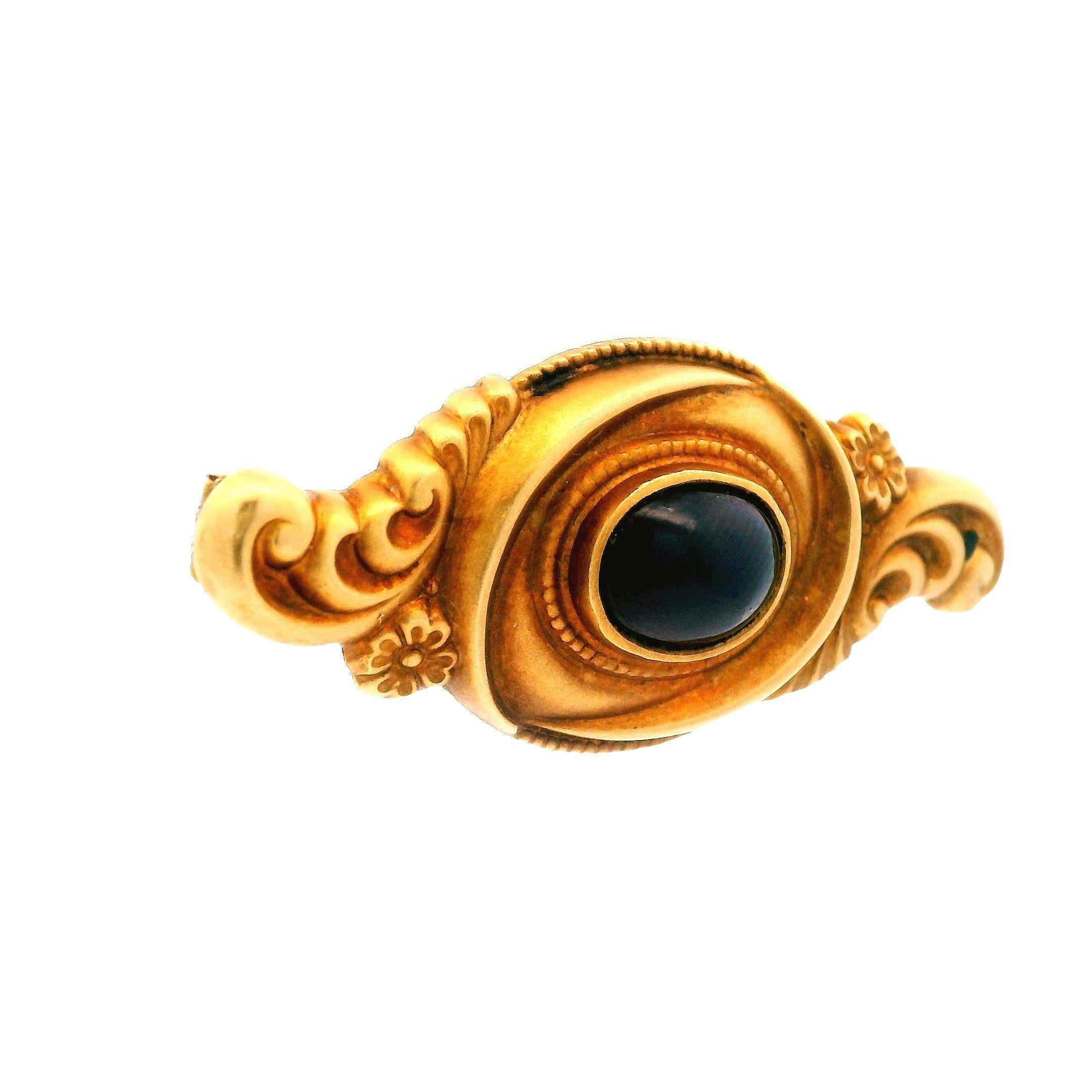 This 14k yellow gold cabochon cut garnet pin is perfect for you next formal event! The matte finish and intricate detail within the floral pattern of the yellow gold are what make this pin stand out amongst the best. The center of this gorgeous ring