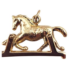 Charm a forma di cavallo articolato in oro giallo 14K #21987