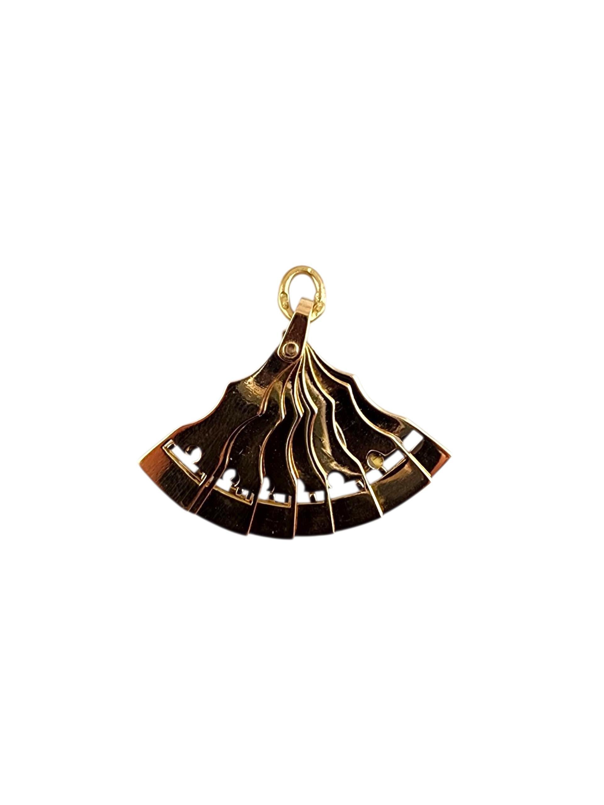 14K Yellow Gold Articulating Hand Fan Charm with Enamel #22503

This 14K yellow gold hand fan charm features delicate detailing and a polished finish, capturing the elegance and grace of a traditional fan. Symbolizing beauty, sophistication, and