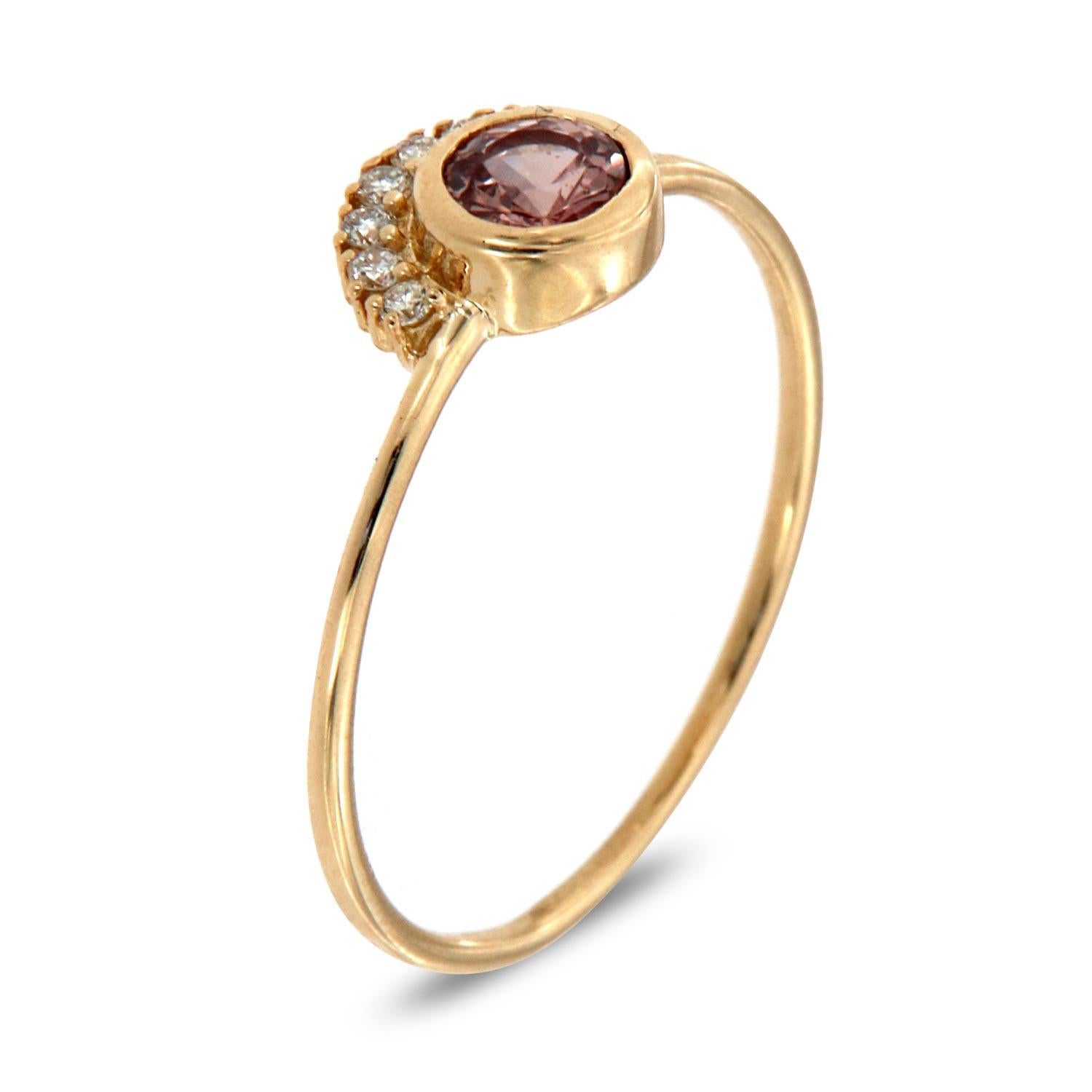 This petite fashion ring is impressive in its vintage appeal, featuring a bezeled natural pink round brilliant sapphire, accented with round brilliant diamonds. Experience the difference in person!

Product details: 

Center Gemstone Type: