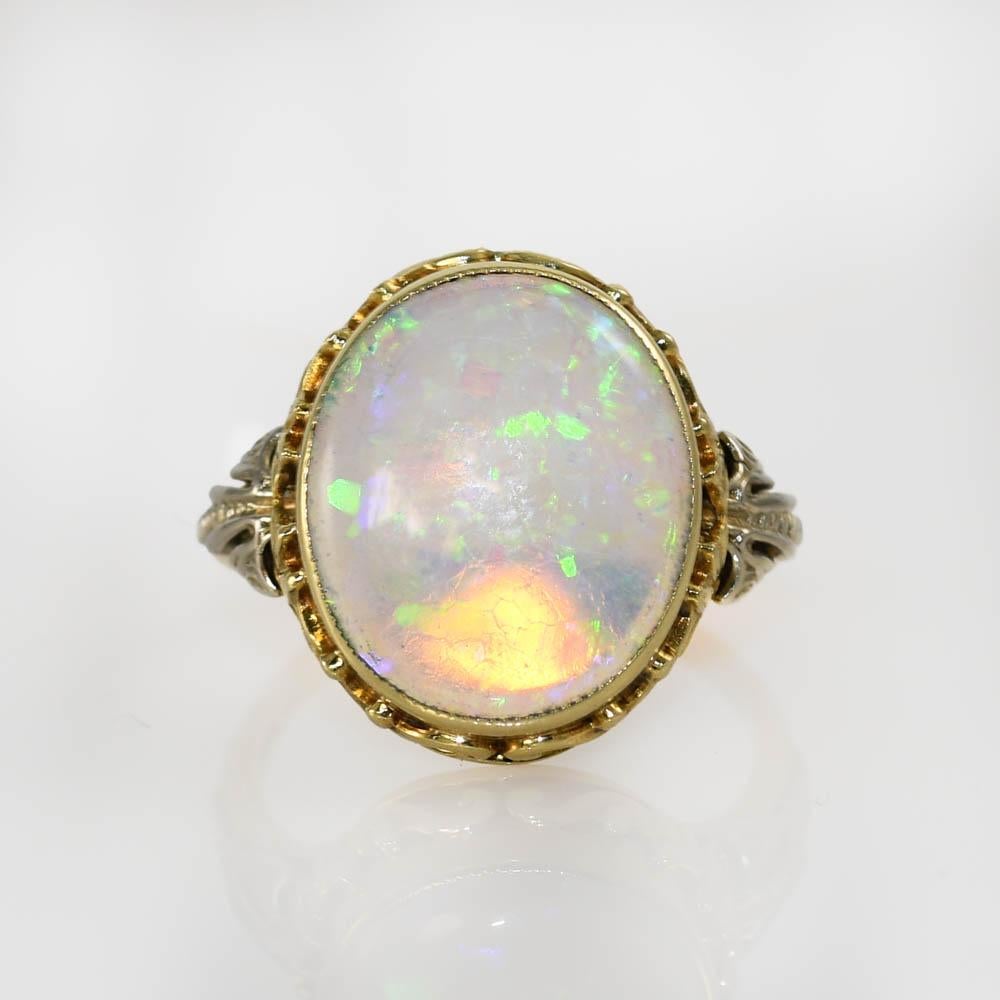 14K Yellow Gold Australian Opal Ring, 2.80ct, 4g
Ladies Australian crystal opal ring with 14k yellow gold setting.
Stamped 14k and weighs 4 grams gross weight.
The opal is a solid piece and measures 14.5 x 12.3 x 2.8mm, approximately 3.00