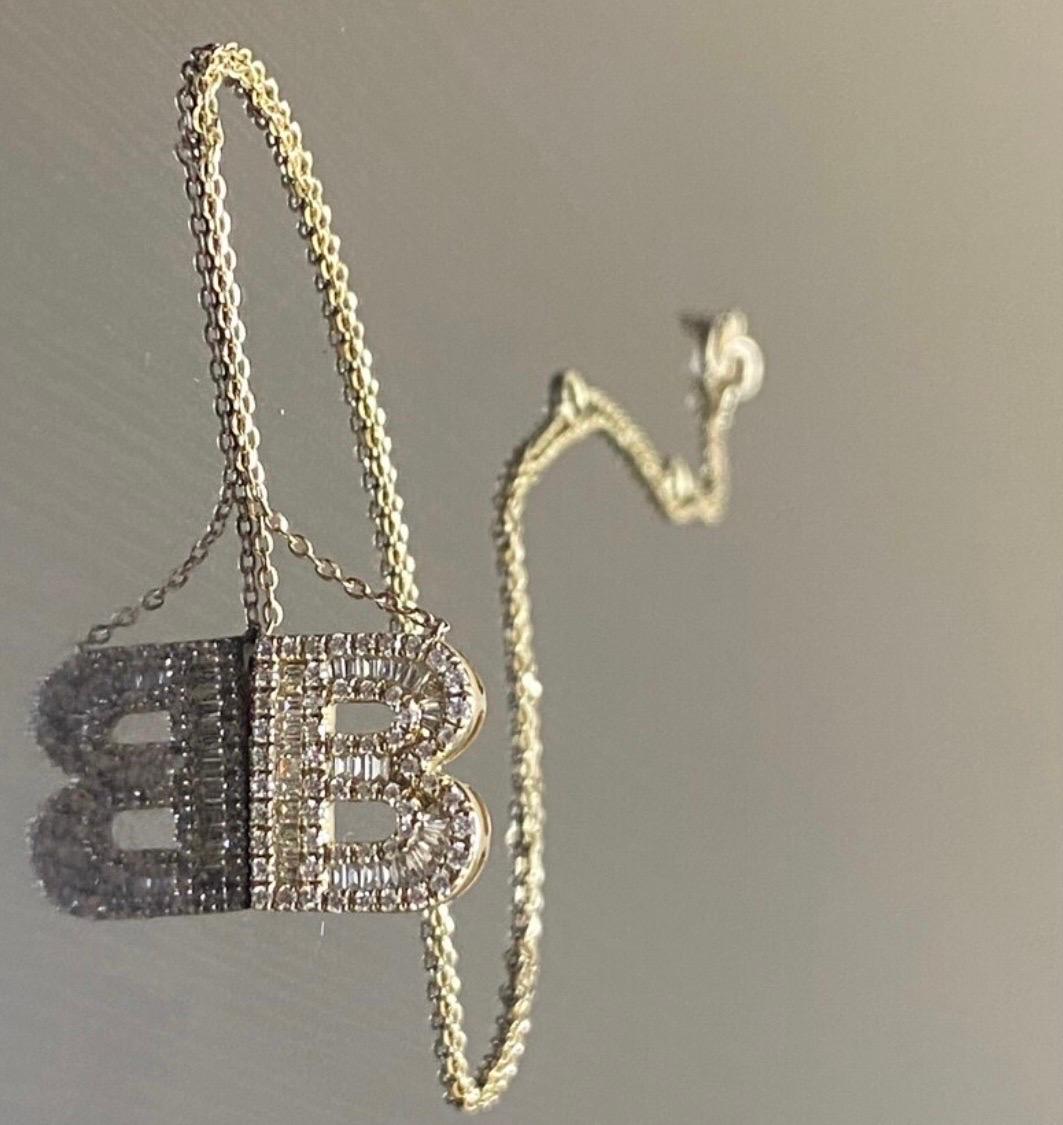DeKara Designs Clearance

Modern Handmade Diamond 14K Yellow Gold B Initial Necklace.

Metal- 14K White Gold, .583.

Stones- 32 Regular and Special Cut Baguette Diamonds, 56 Round Diamonds H-I Color VS2-SI1 Clarity, 1.08 Carats Total Diamond