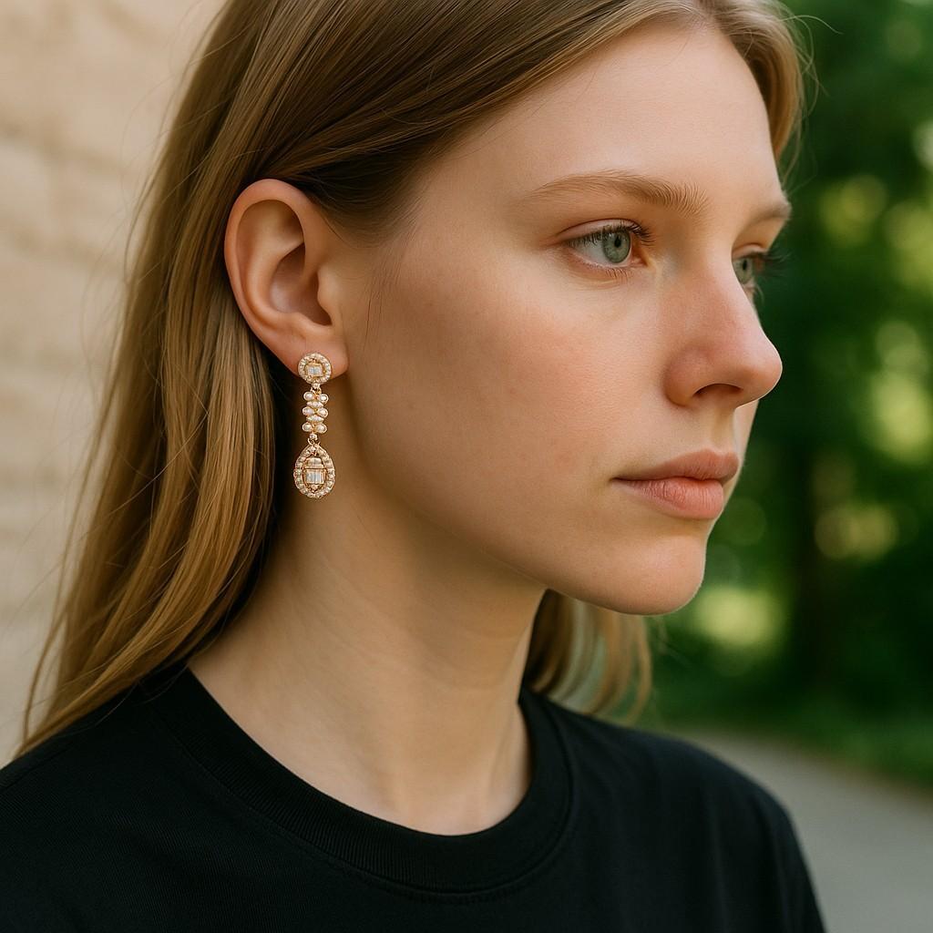 Delicate in size yet radiant in sparkle, these 14K Yellow Gold Diamond Dangle Earrings are the perfect blend of timeless charm and modern sophistication. Crafted in luminous 14K yellow gold and hallmarked 585, each earring is intricately set with a