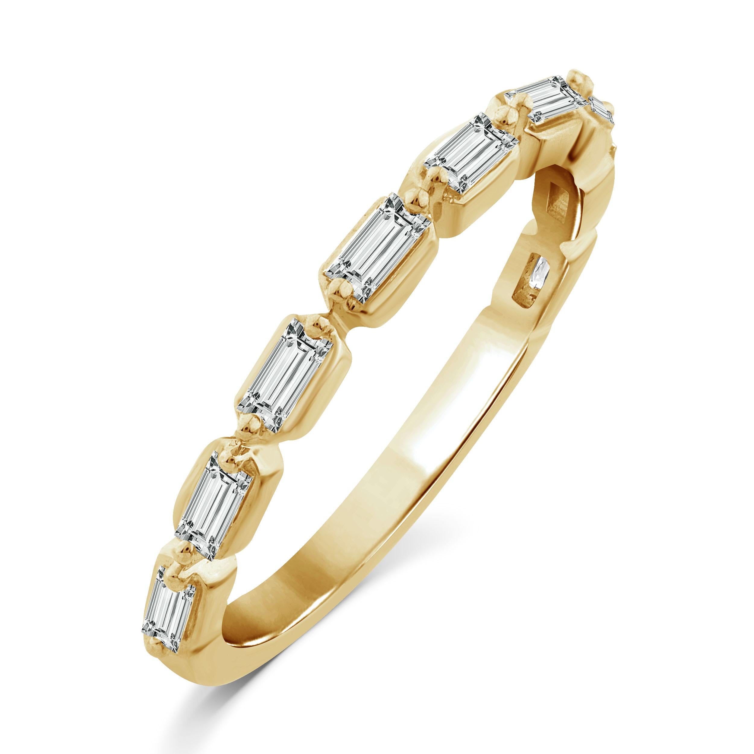 The Floating Baguette Diamond Band Ring is our take on classic diamond engagement bands with a modern twist. This semi eternity diamond band ring features horizontal baguettes set with spaces in between to create a floating look. This 14K yellow