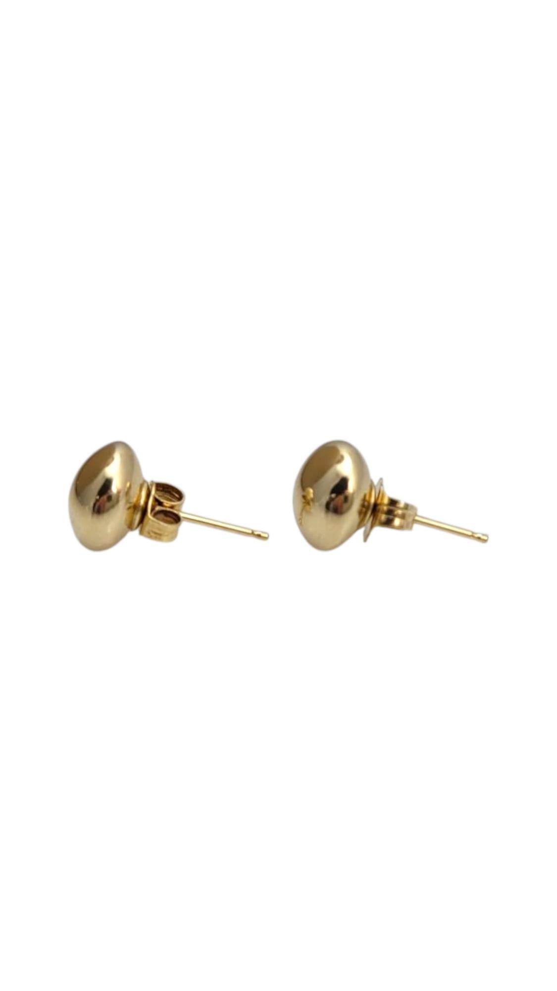 14K Yellow Gold Ball Button Stud Earrings-

Simple yet sophisticated, these 14k yellow gold ball stud earrings offer timeless elegance in a minimalist design. Their polished, spherical shape adds a subtle touch of shine, making them perfect for