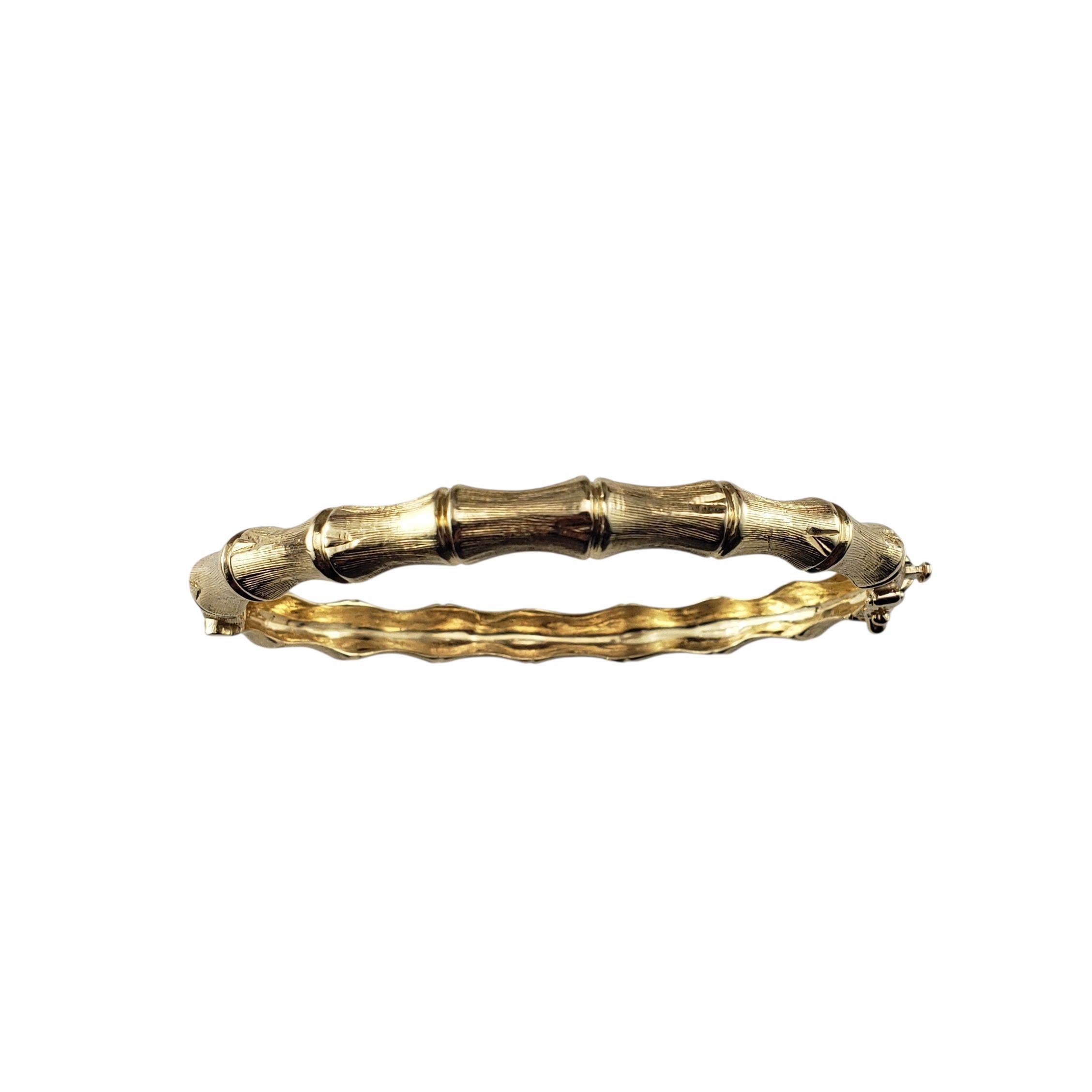 14 Karat Yellow Gold Bamboo Bangle Bracelet-

This elegant bracelet is crafted in 14K yellow gold and styled in a lifelike bamboo motif, symbolizing strength, resilience, and good fortune. Hinged closure.

Size: 6.5 inches

Width: 6.5 mm

Weight: