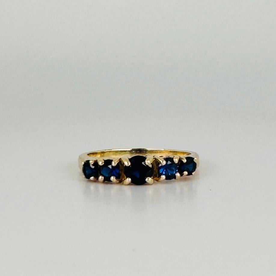 Round Cut 14k Yellow Gold Ring Five round-Cut Dark Blue Sapphires of about 0.95 carat