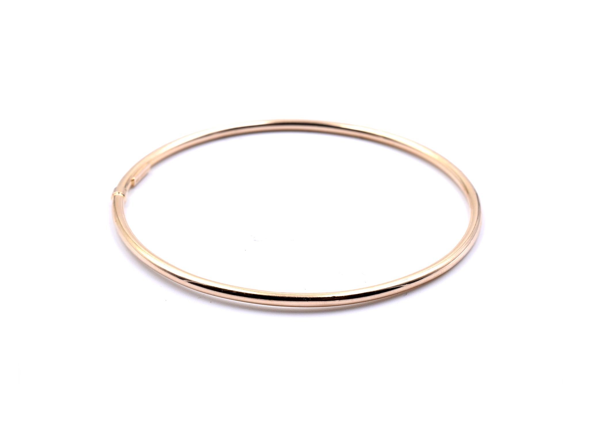 Designer: custom design
Material: 14k yellow gold
Dimensions: bracelet will fit an 8-inch wrist and it is 2.44mm wide
Weight: 2.09 grams

