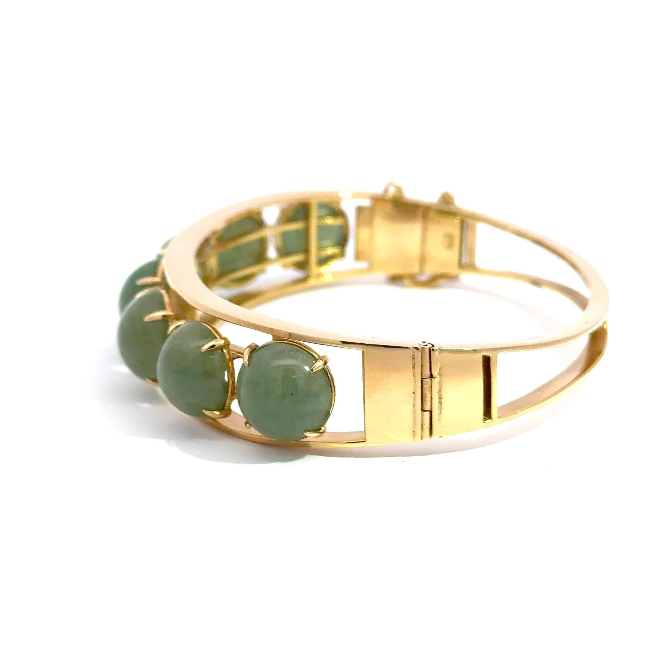 Art Deco 14k Yellow Gold Bangle with 7 Green Jade Cabochons – 29.20g of Timeless Elegance For Sale