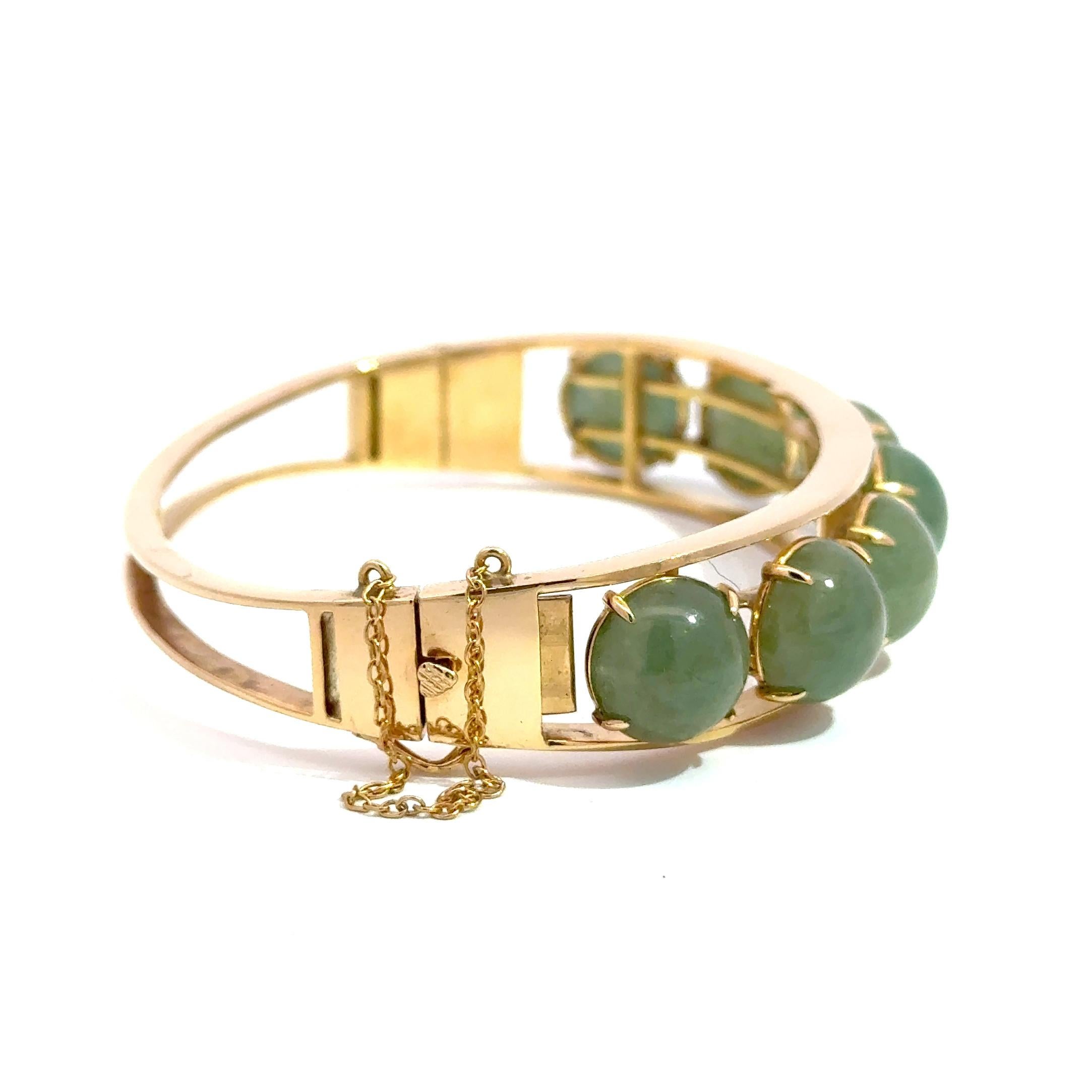 Women's 14k Yellow Gold Bangle with 7 Green Jade Cabochons – 29.20g of Timeless Elegance For Sale
