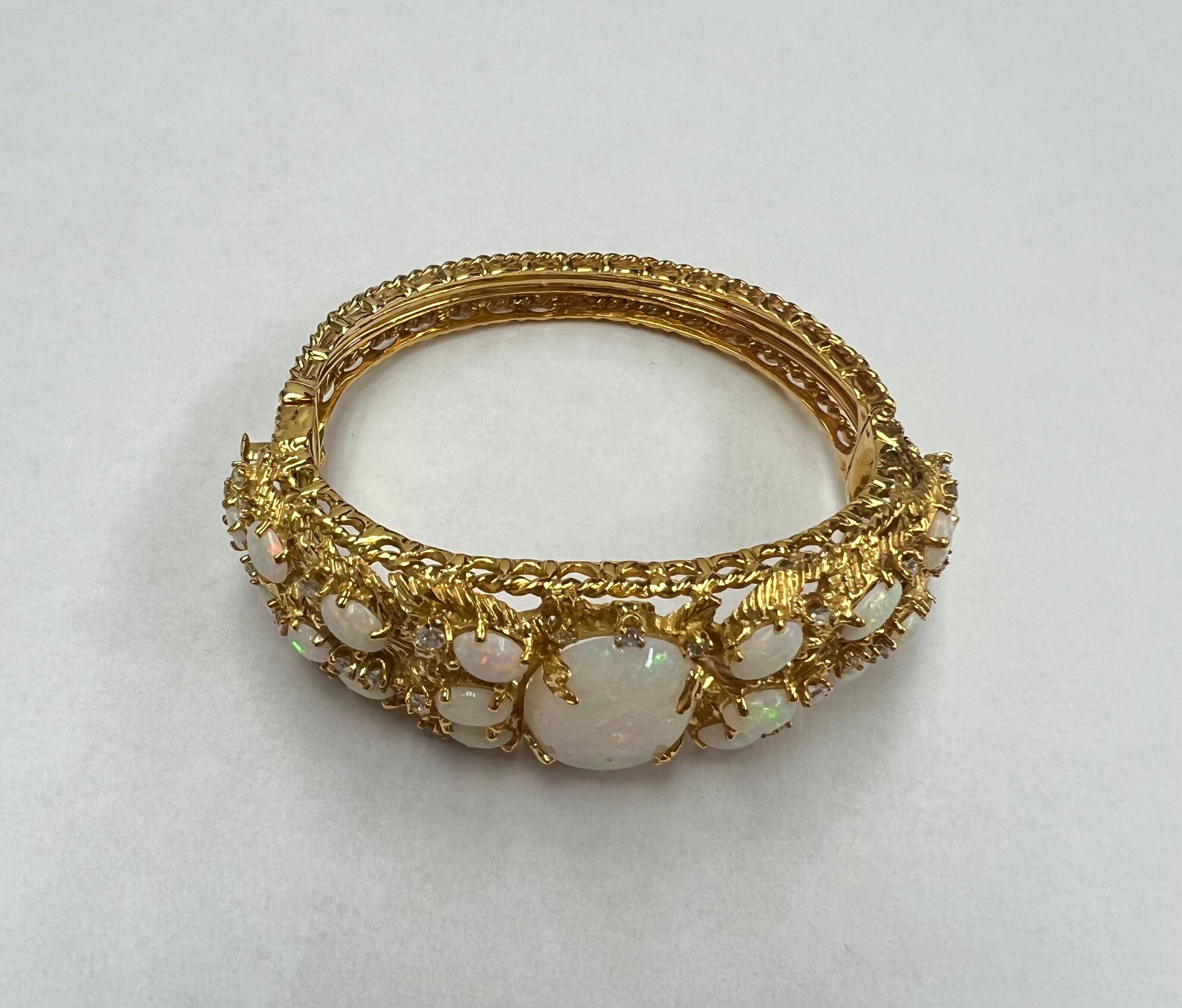 Showcasing a beautiful all natural beautiful Opals and Round Diamonds. This is a staple piece in anyone's jewelry collection. It was carefully handmade in Los Angeles California and polished in 14k yellow gold. The bangle features a very unique and